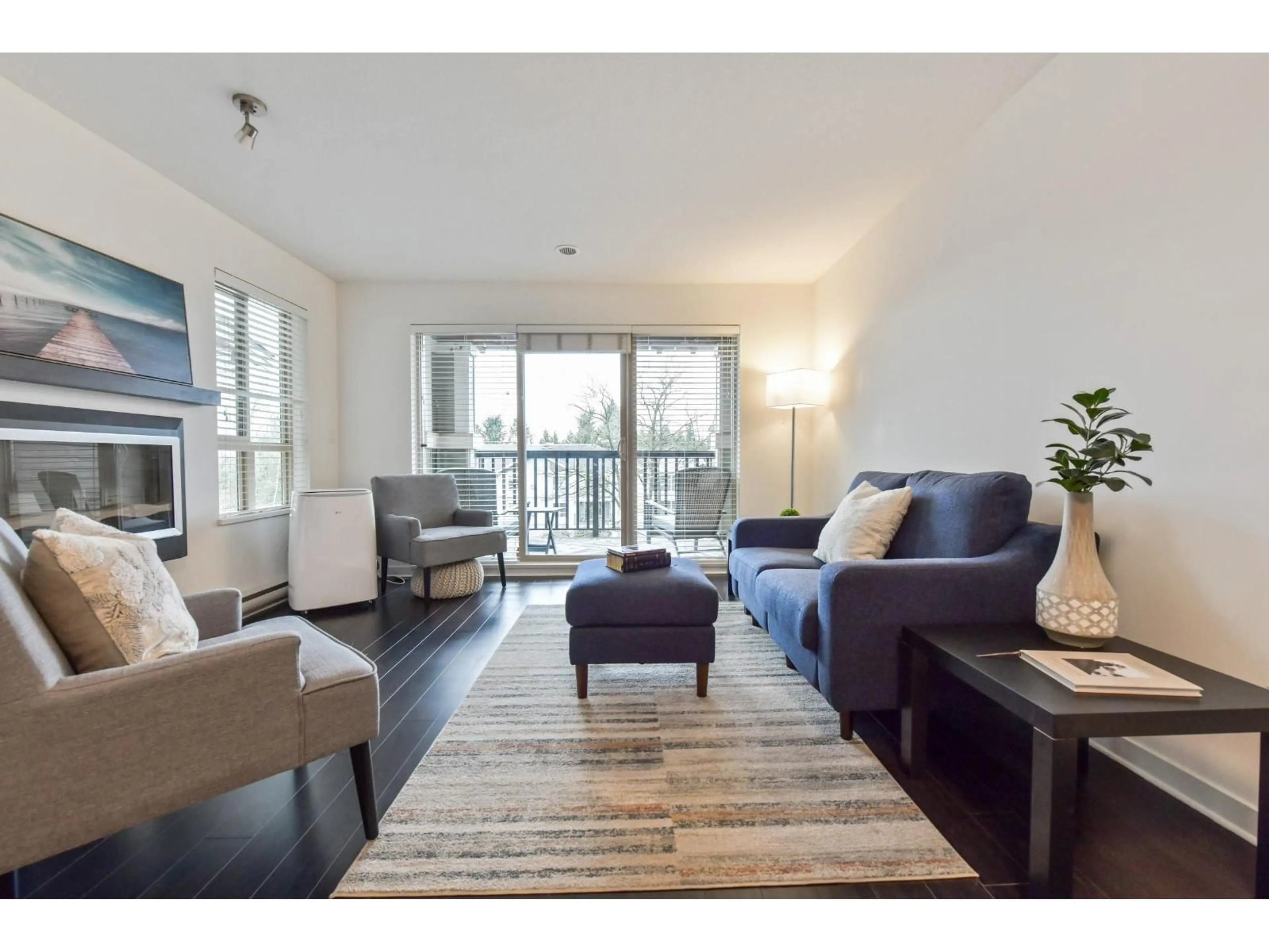 Living room with furniture, wood/laminate floor for 426 - 21009 56 AVENUE, Langley British Columbia V3A0C9