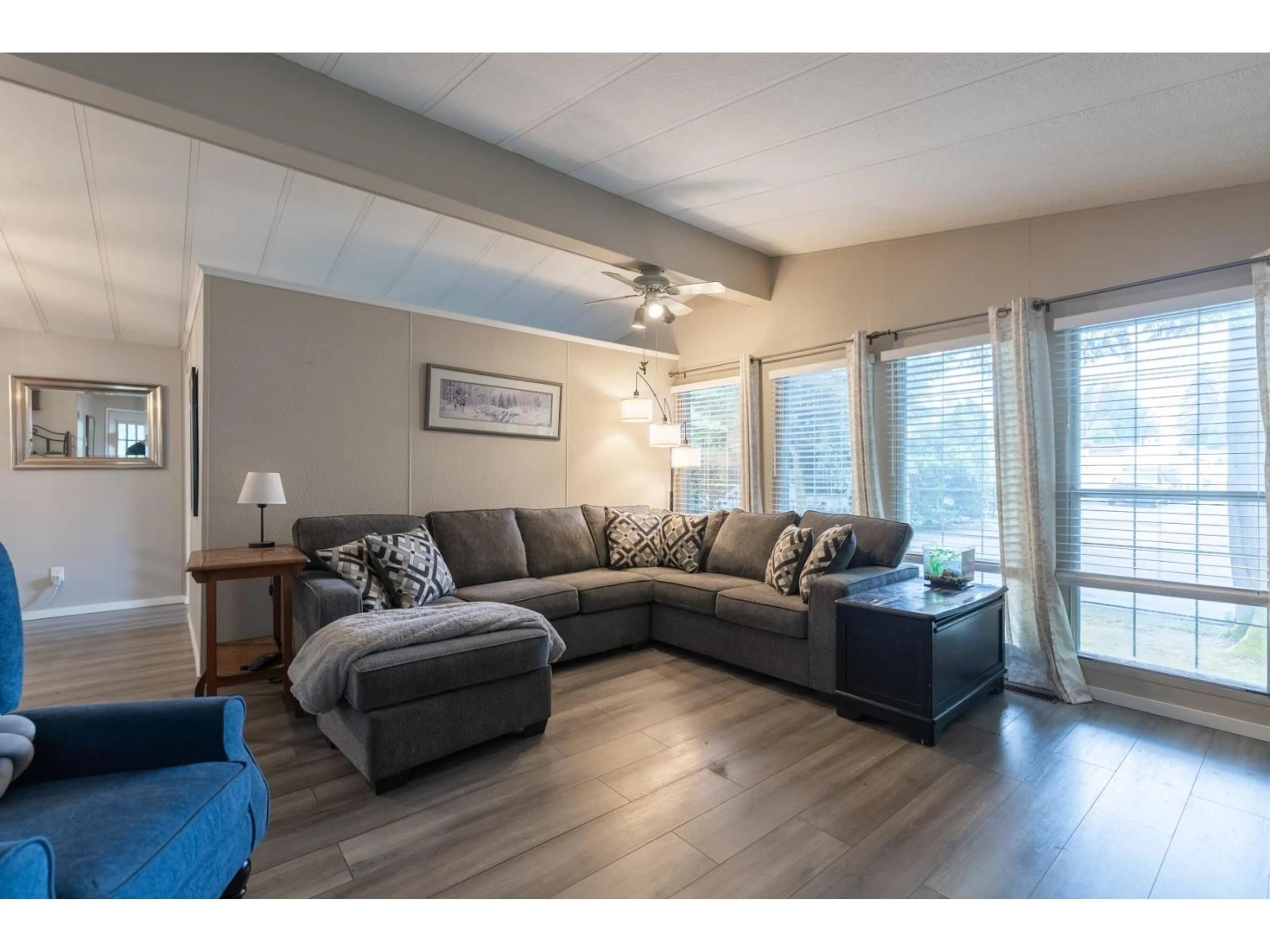 Living room with furniture, wood/laminate floor for 74 - 9080 198 STREET, Langley British Columbia V1M3A8