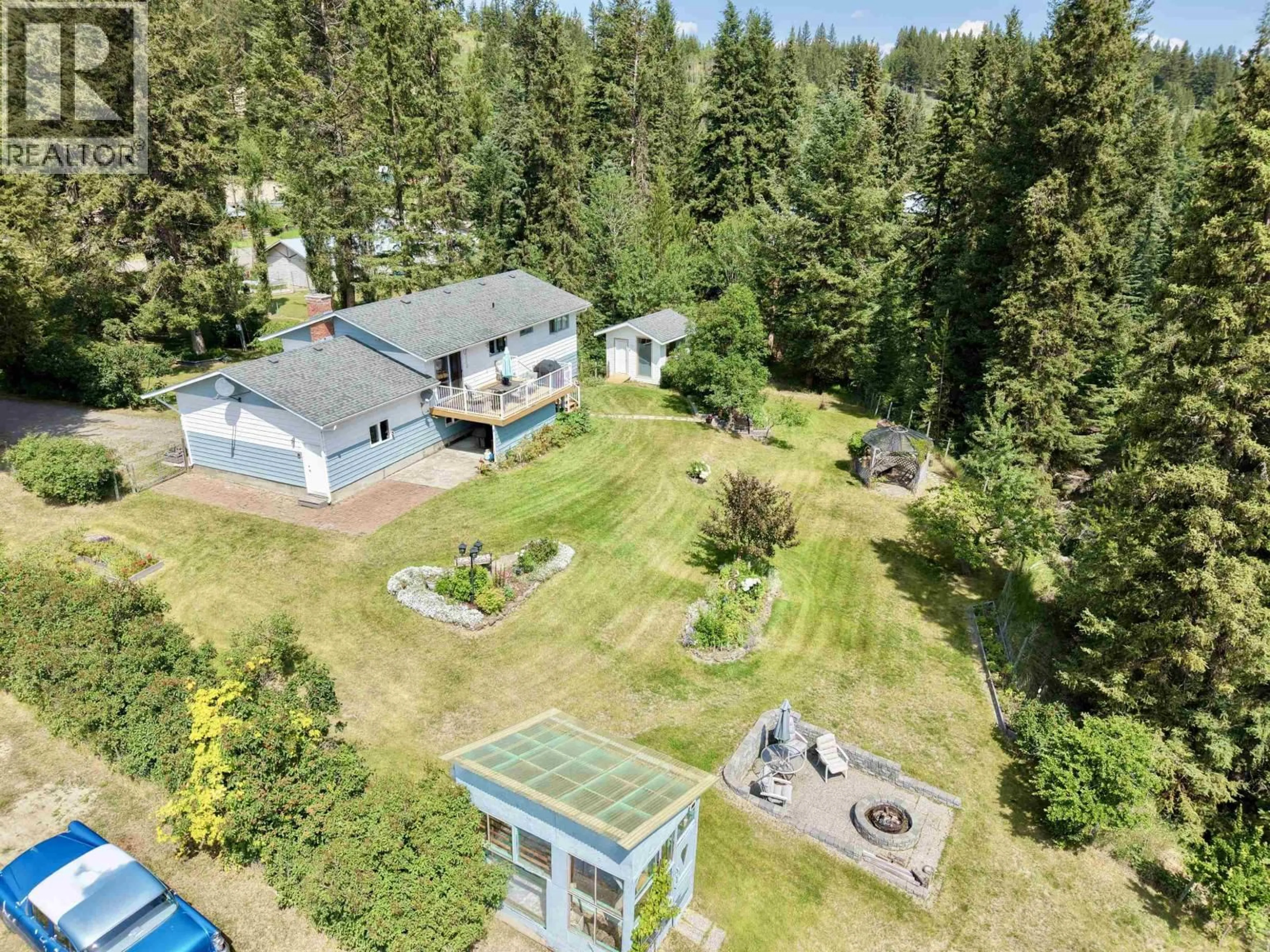 A pic from outside/outdoor area/front of a property/back of a property/a pic from drone, forest/trees view for 5451 KENNEDY ROAD, 100 Mile House British Columbia V0K2E3