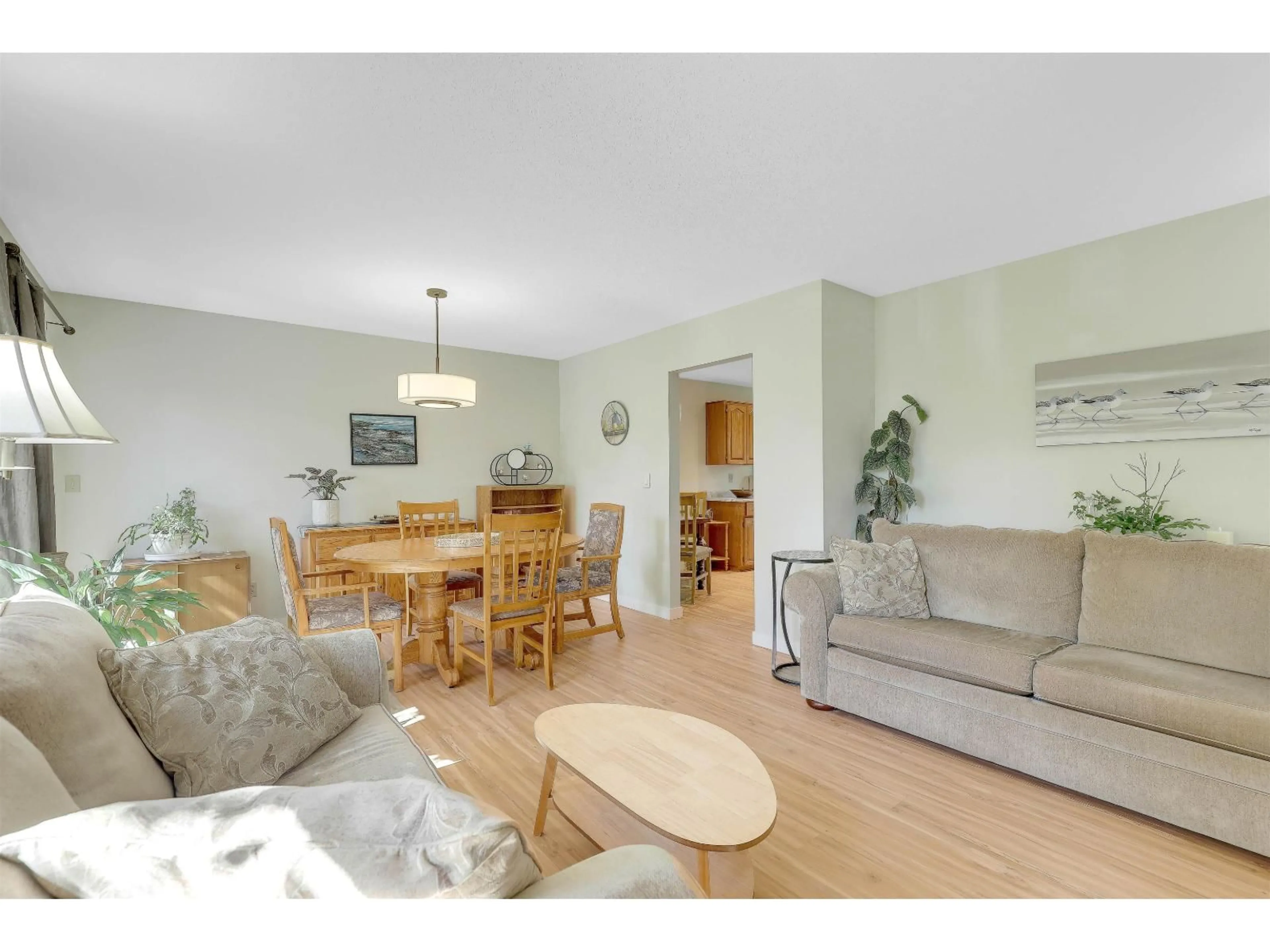 Living room with furniture, wood/laminate floor for 1854 129 STREET, Surrey British Columbia V4A7V2
