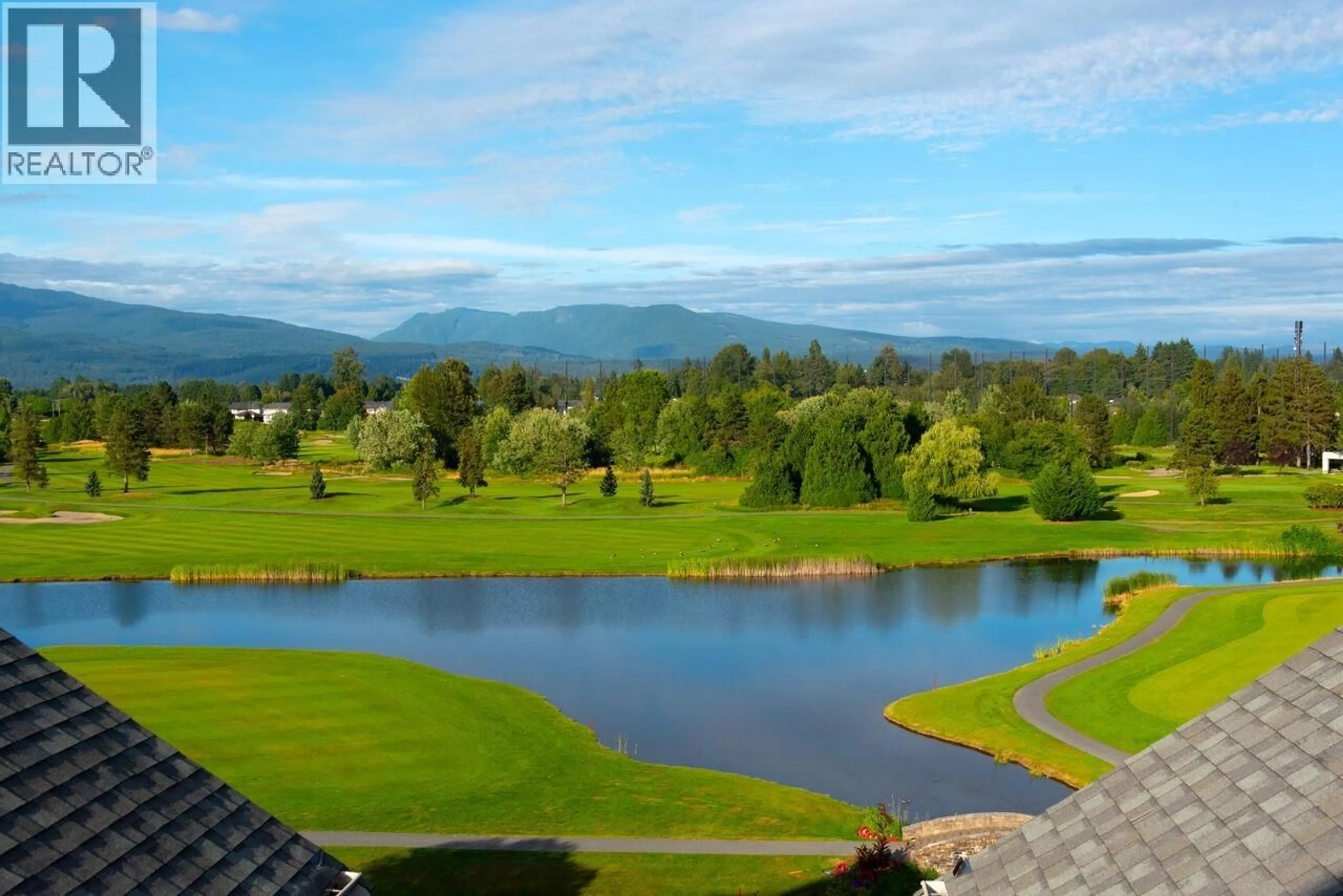 A pic from outside/outdoor area/front of a property/back of a property/a pic from drone, water/lake/river/ocean view for 409 - 19677 MEADOW GARDENS WAY, Pitt Meadows British Columbia V3Y0A2