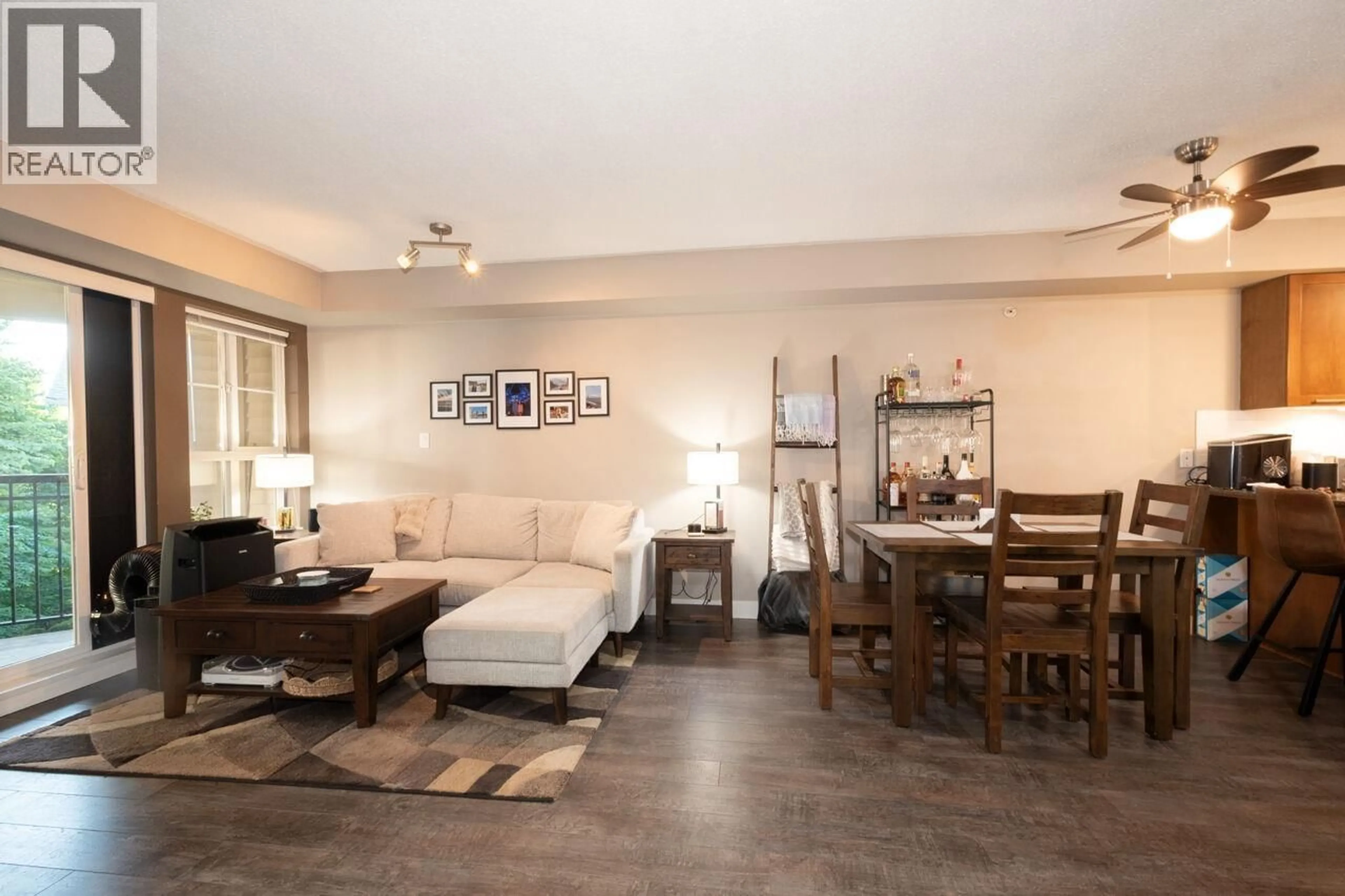 Living room with furniture, wood/laminate floor for 409 - 19677 MEADOW GARDENS WAY, Pitt Meadows British Columbia V3Y0A2