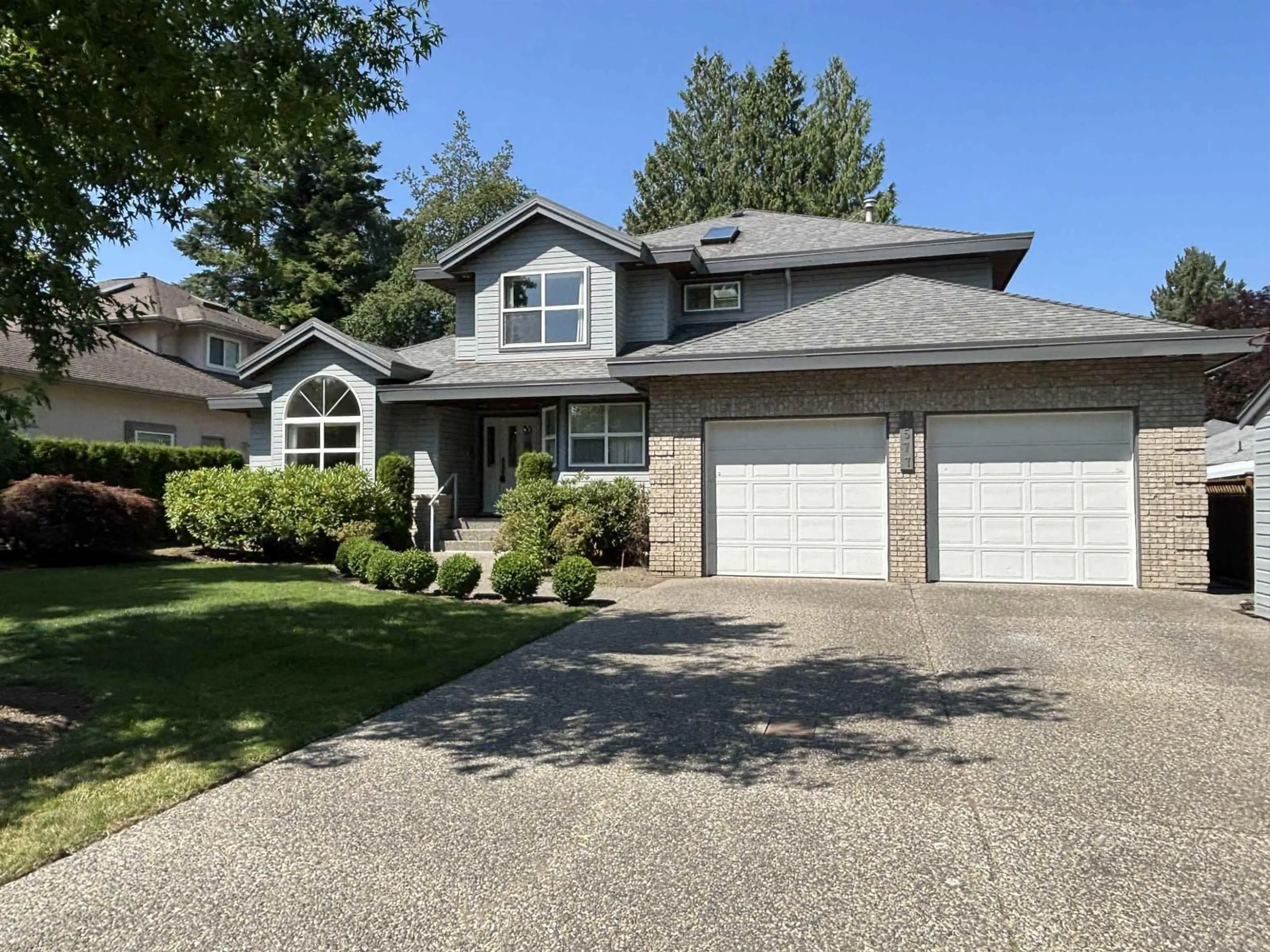 Home with vinyl exterior material, street for 4577 217 STREET, Langley British Columbia V3A9B7