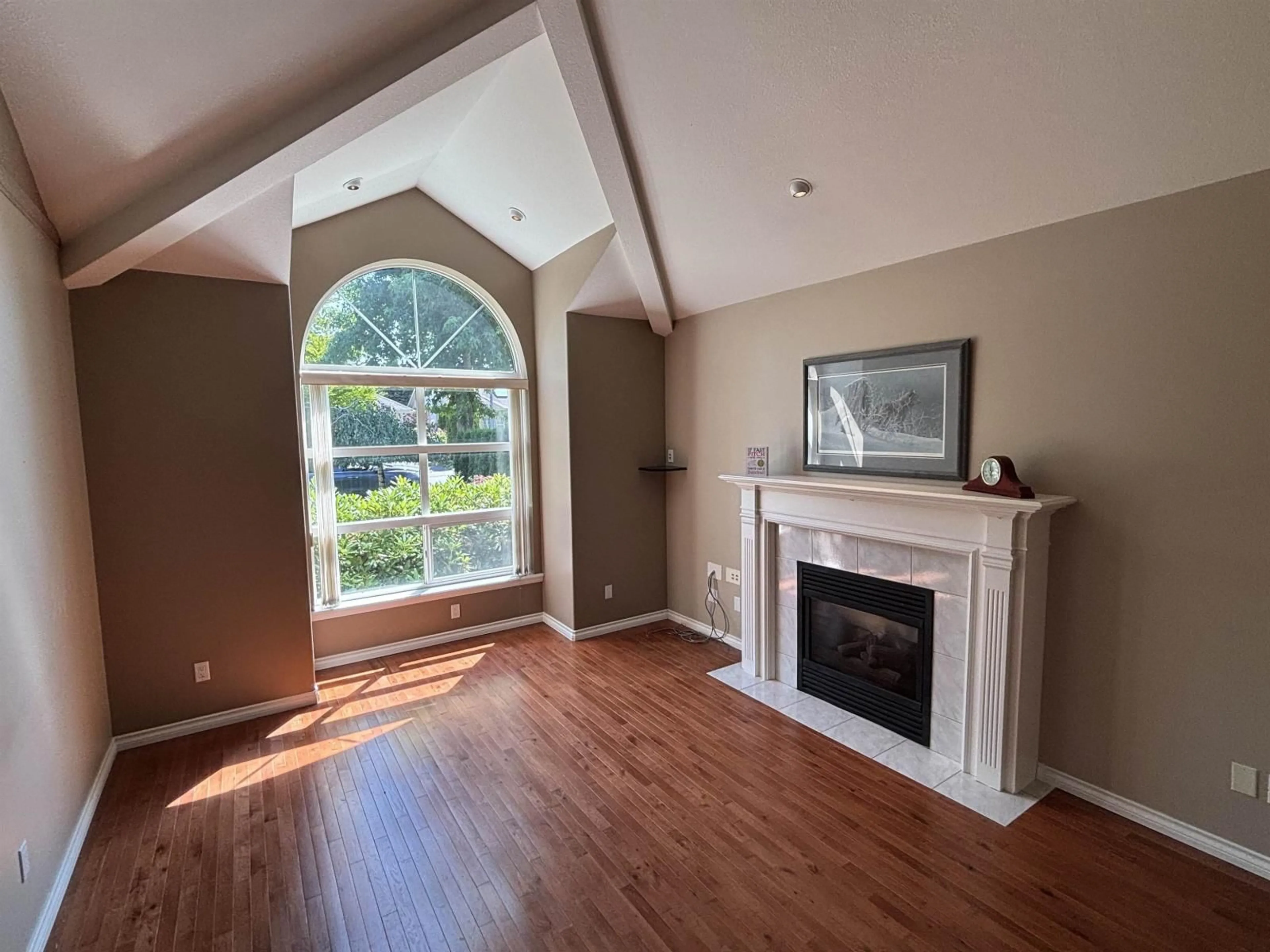 Living room with furniture, wood/laminate floor for 4577 217 STREET, Langley British Columbia V3A9B7