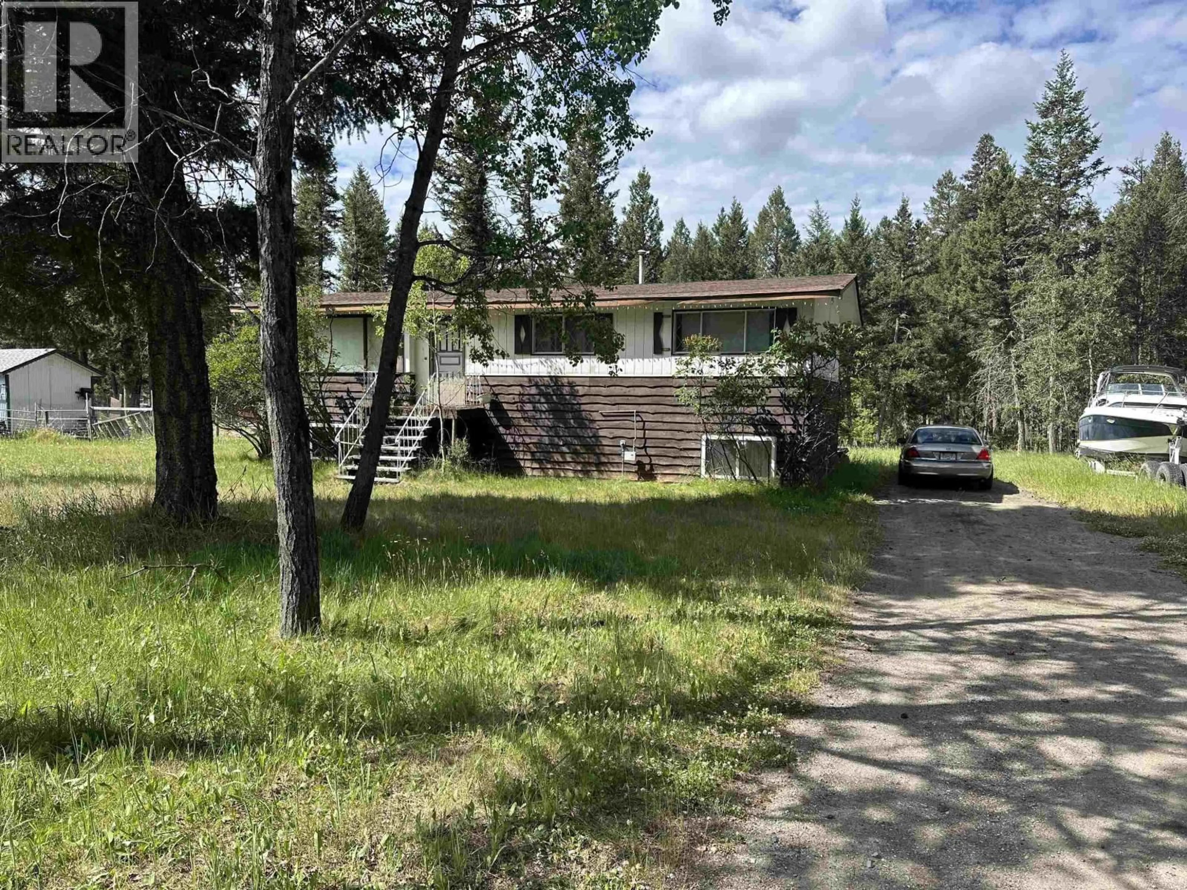 A pic from outside/outdoor area/front of a property/back of a property/a pic from drone, forest/trees view for 4972 MONICAL ROAD, 108 Mile Ranch British Columbia V0K2E1