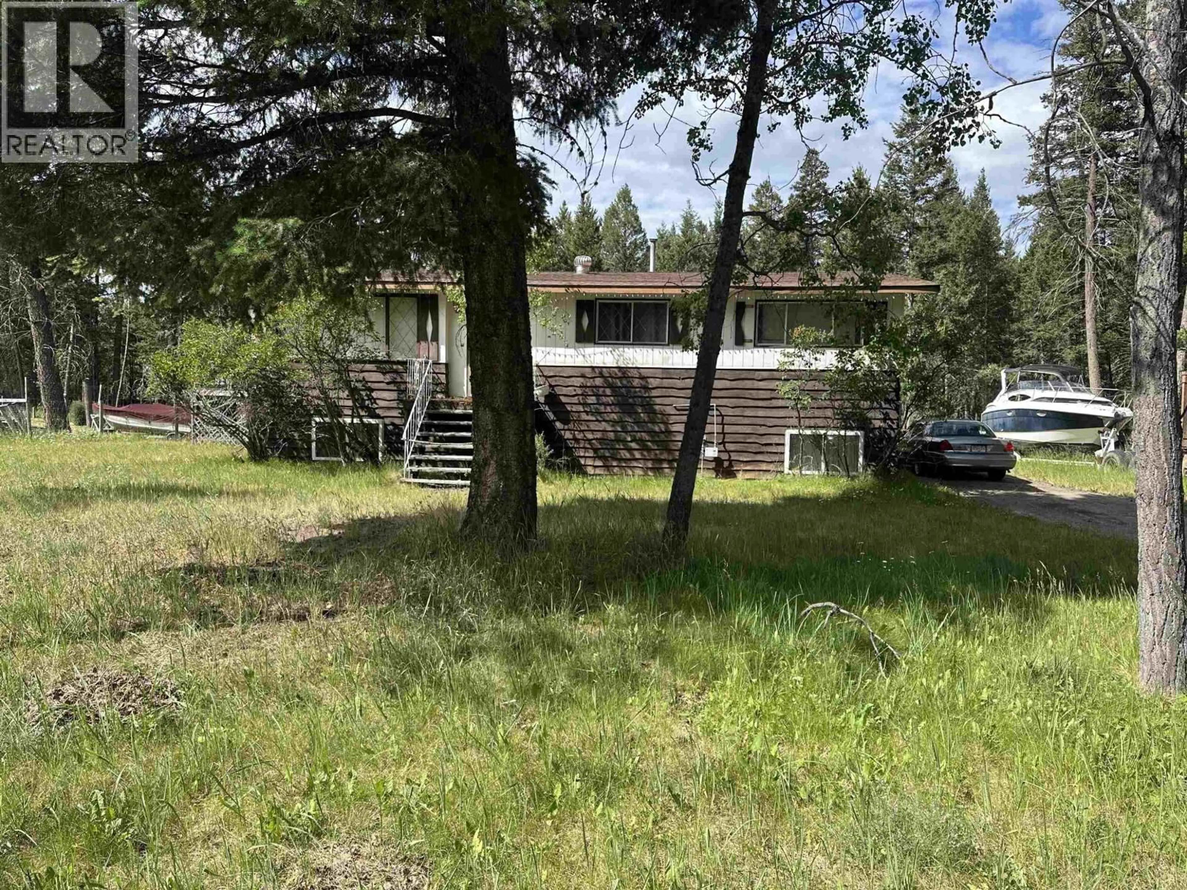 A pic from outside/outdoor area/front of a property/back of a property/a pic from drone, forest/trees view for 4972 MONICAL ROAD, 108 Mile Ranch British Columbia V0K2E1