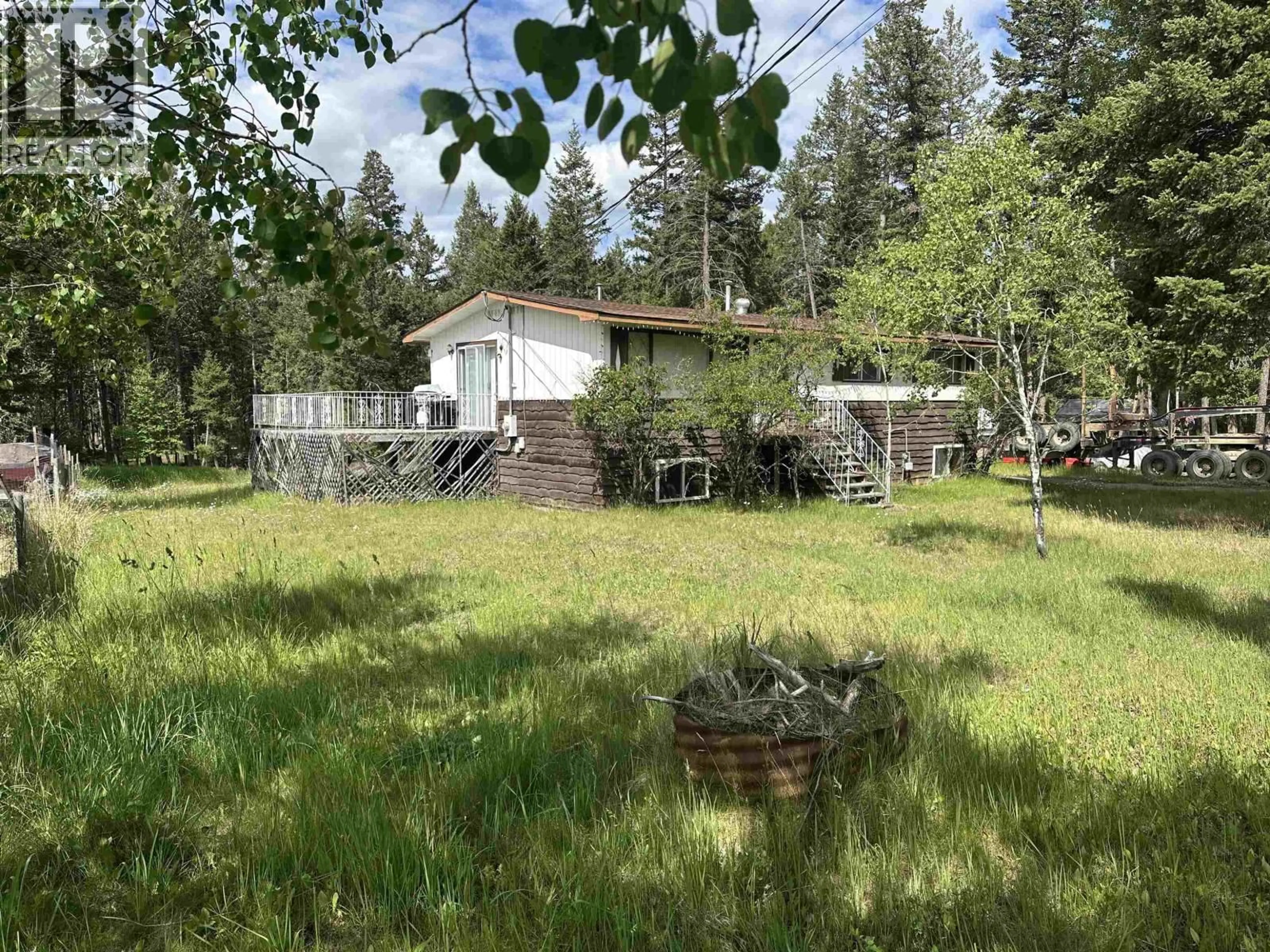 A pic from outside/outdoor area/front of a property/back of a property/a pic from drone, forest/trees view for 4972 MONICAL ROAD, 108 Mile Ranch British Columbia V0K2E1