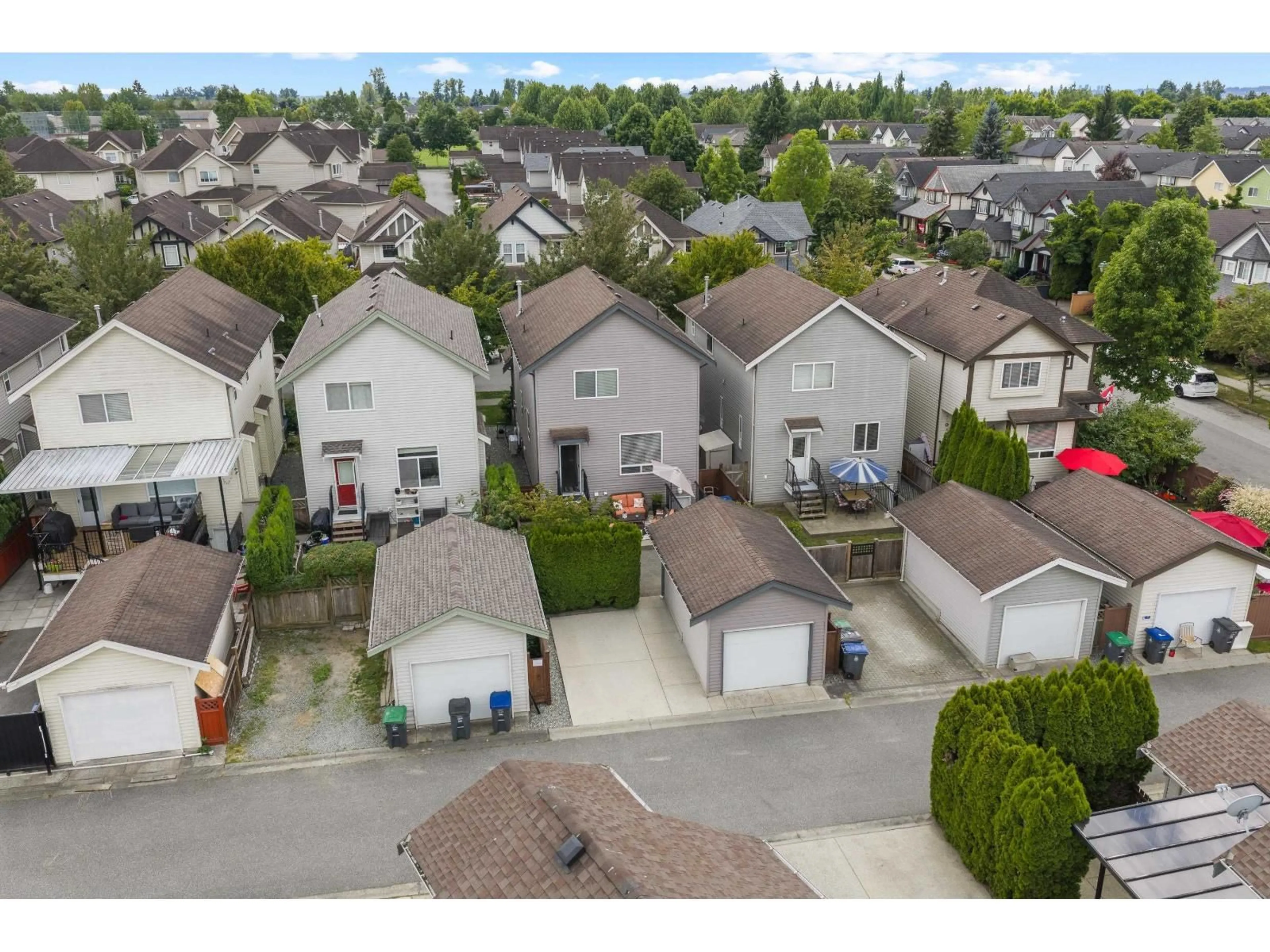 A pic from outside/outdoor area/front of a property/back of a property/a pic from drone, street for 18565 67 AVENUE, Surrey British Columbia V3S1Z1