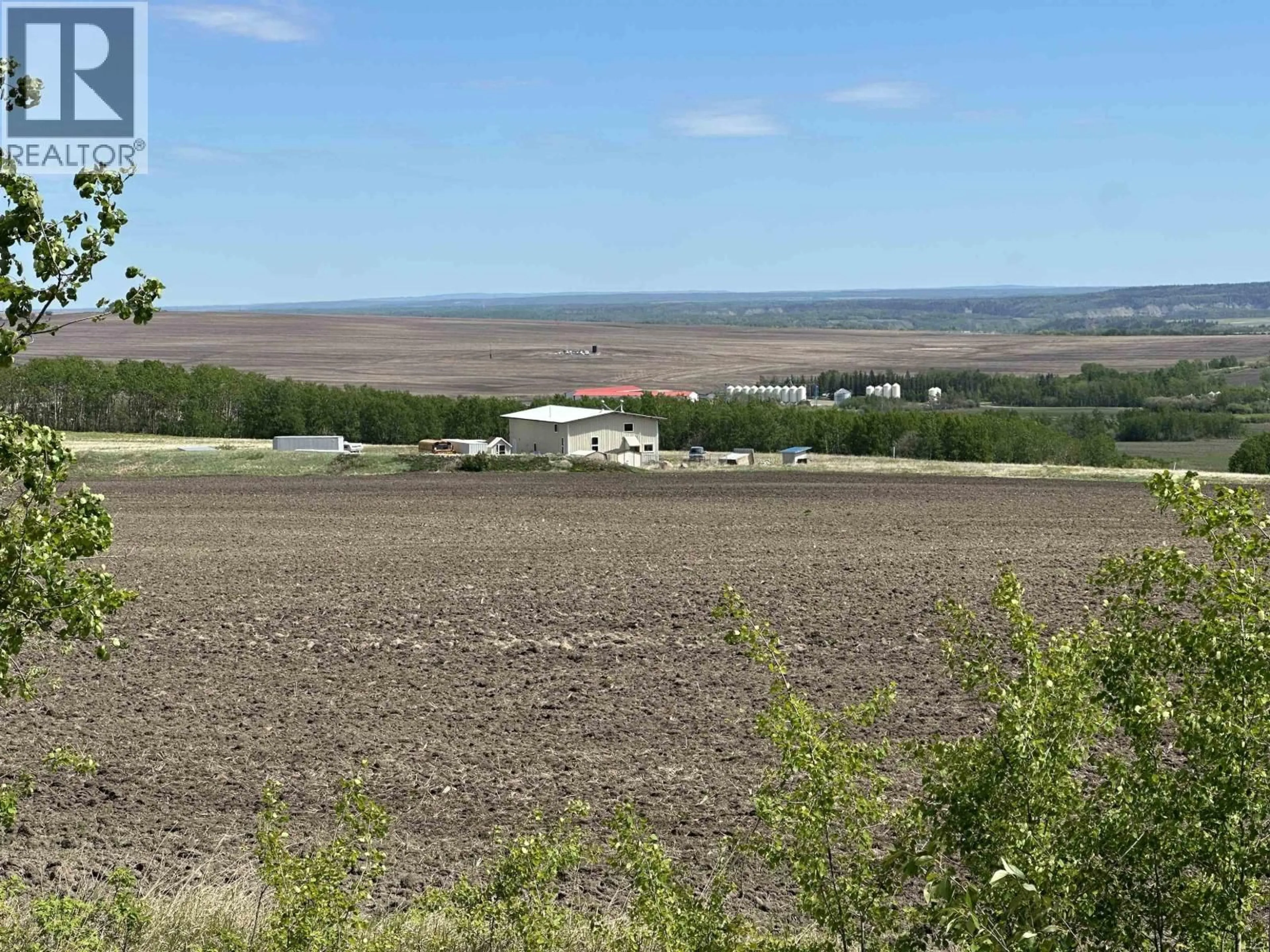 A pic from outside/outdoor area/front of a property/back of a property/a pic from drone, mountain view for 8363 252 ROAD, Fort St. John British Columbia V1J8E3