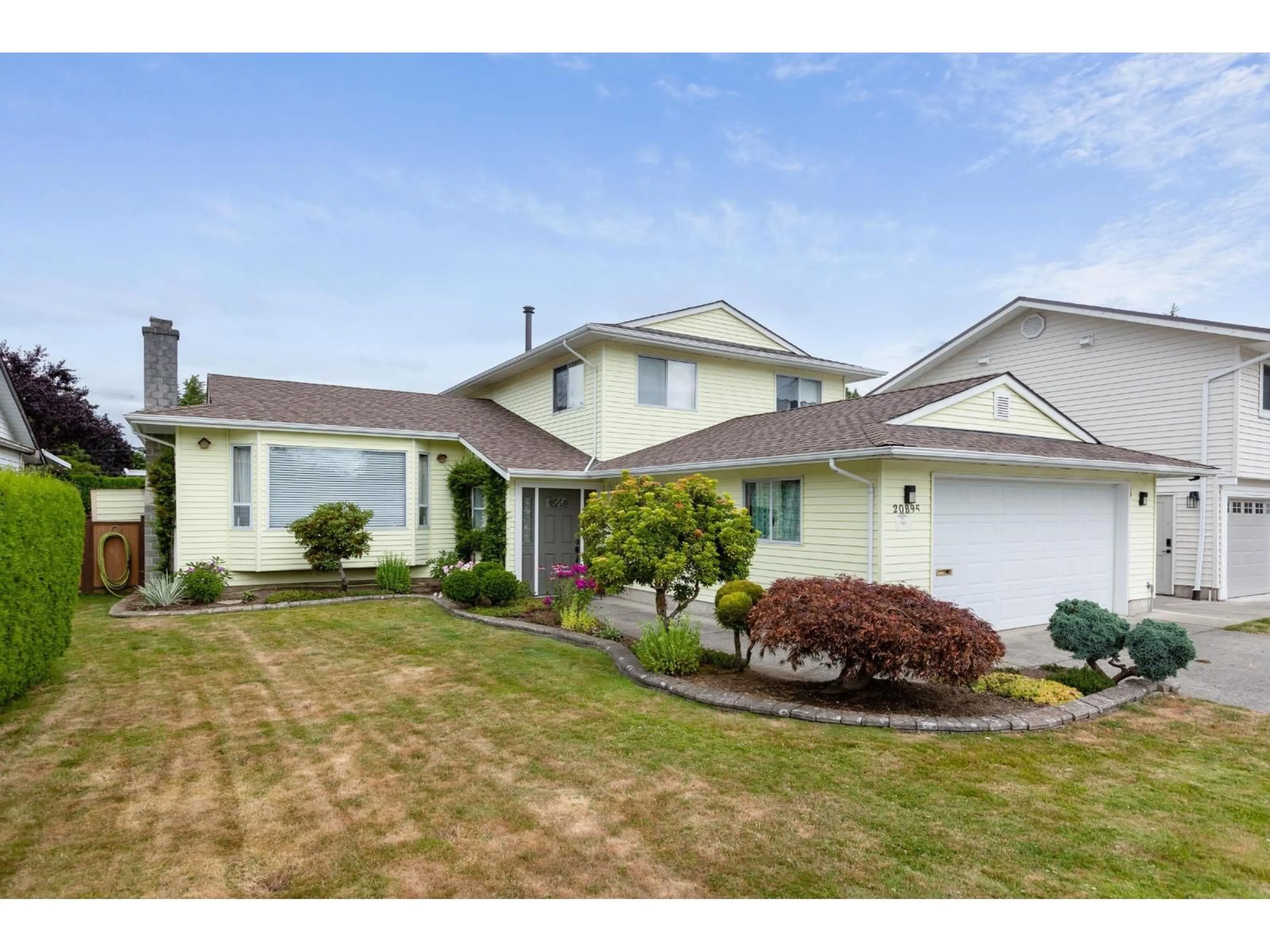 Home with vinyl exterior material, street for 20895 51B AVENUE, Langley British Columbia V3A7K6