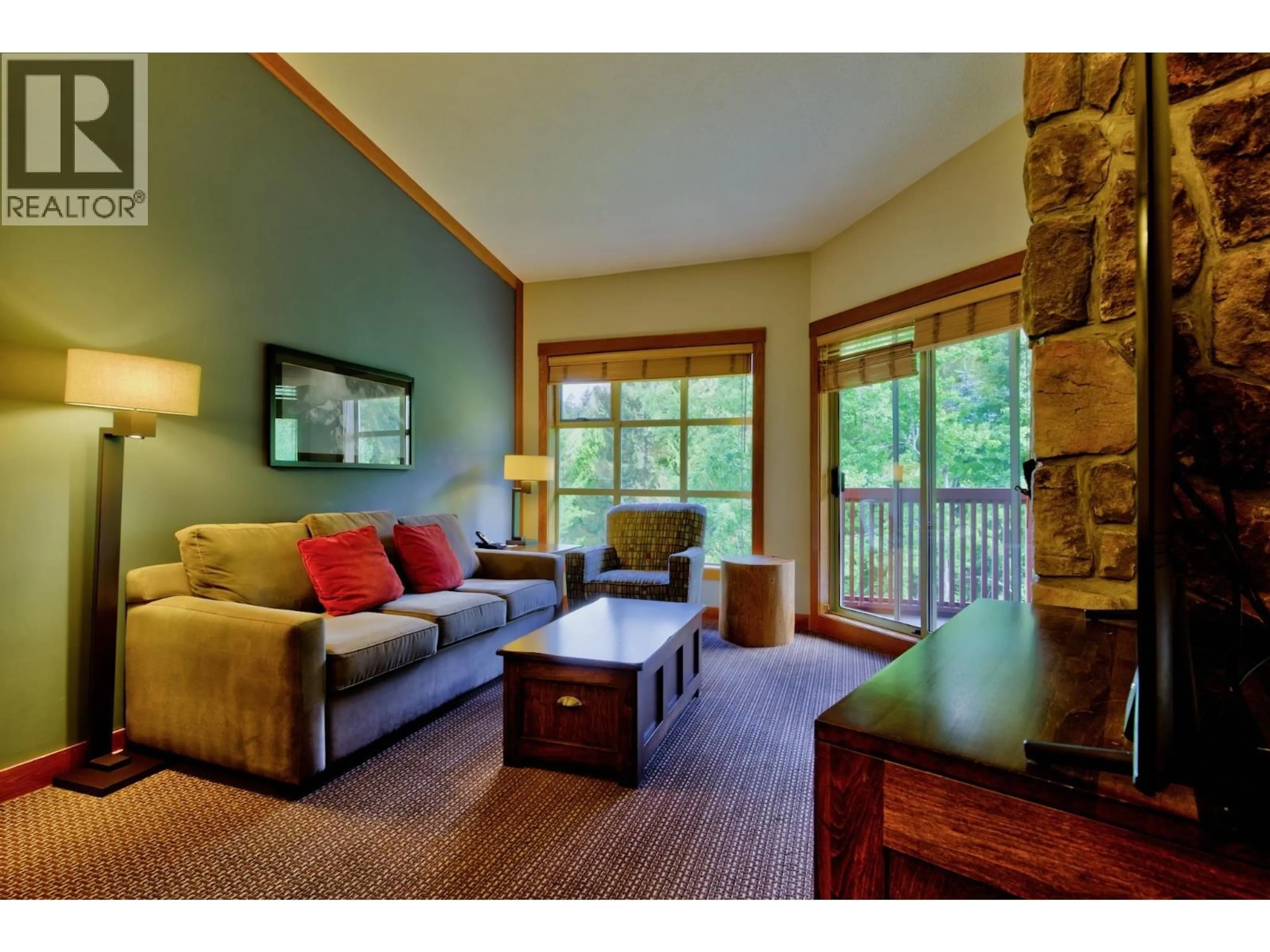 Living room with furniture, wood/laminate floor for 638A - 2036 LONDON LANE, Whistler British Columbia V8E0N7