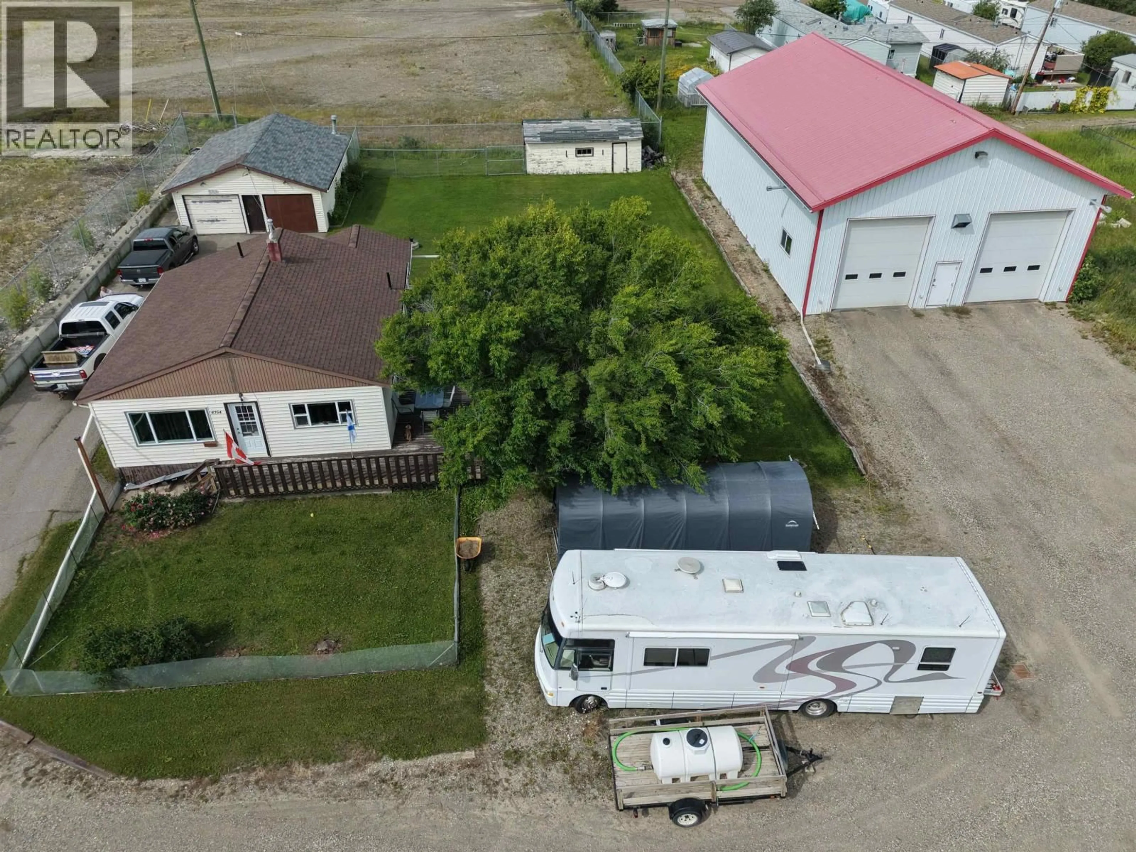 A pic from outside/outdoor area/front of a property/back of a property/a pic from drone, street for 8354 100 AVENUE, Fort St. John British Columbia V1J1W6