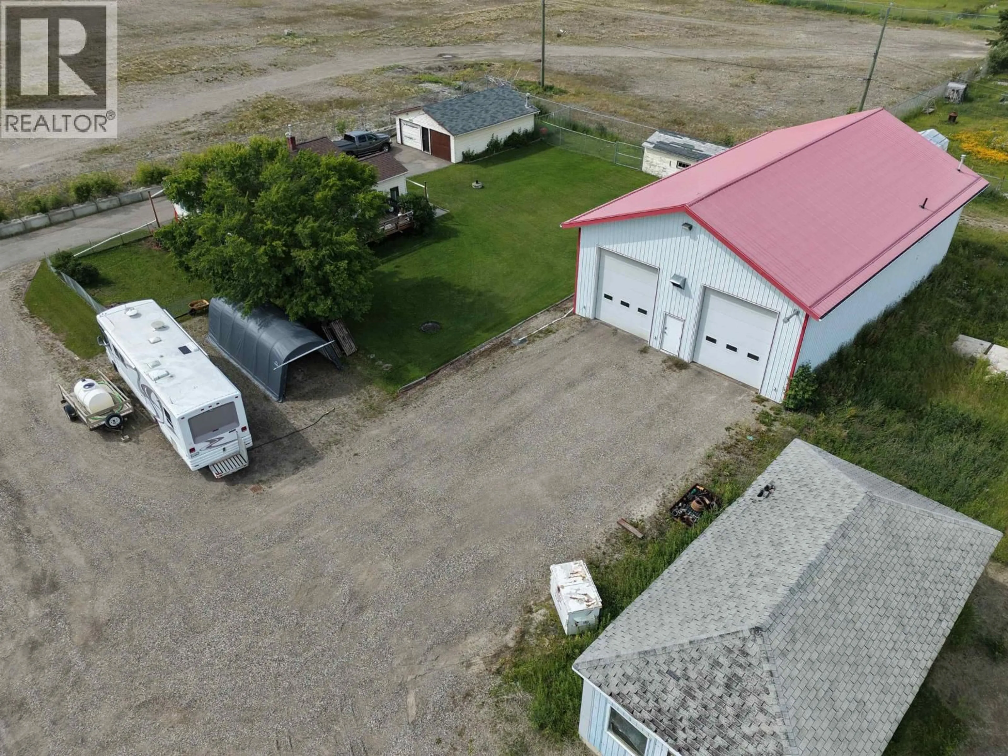 A pic from outside/outdoor area/front of a property/back of a property/a pic from drone, building for 8354 100 AVENUE, Fort St. John British Columbia V1J1W6
