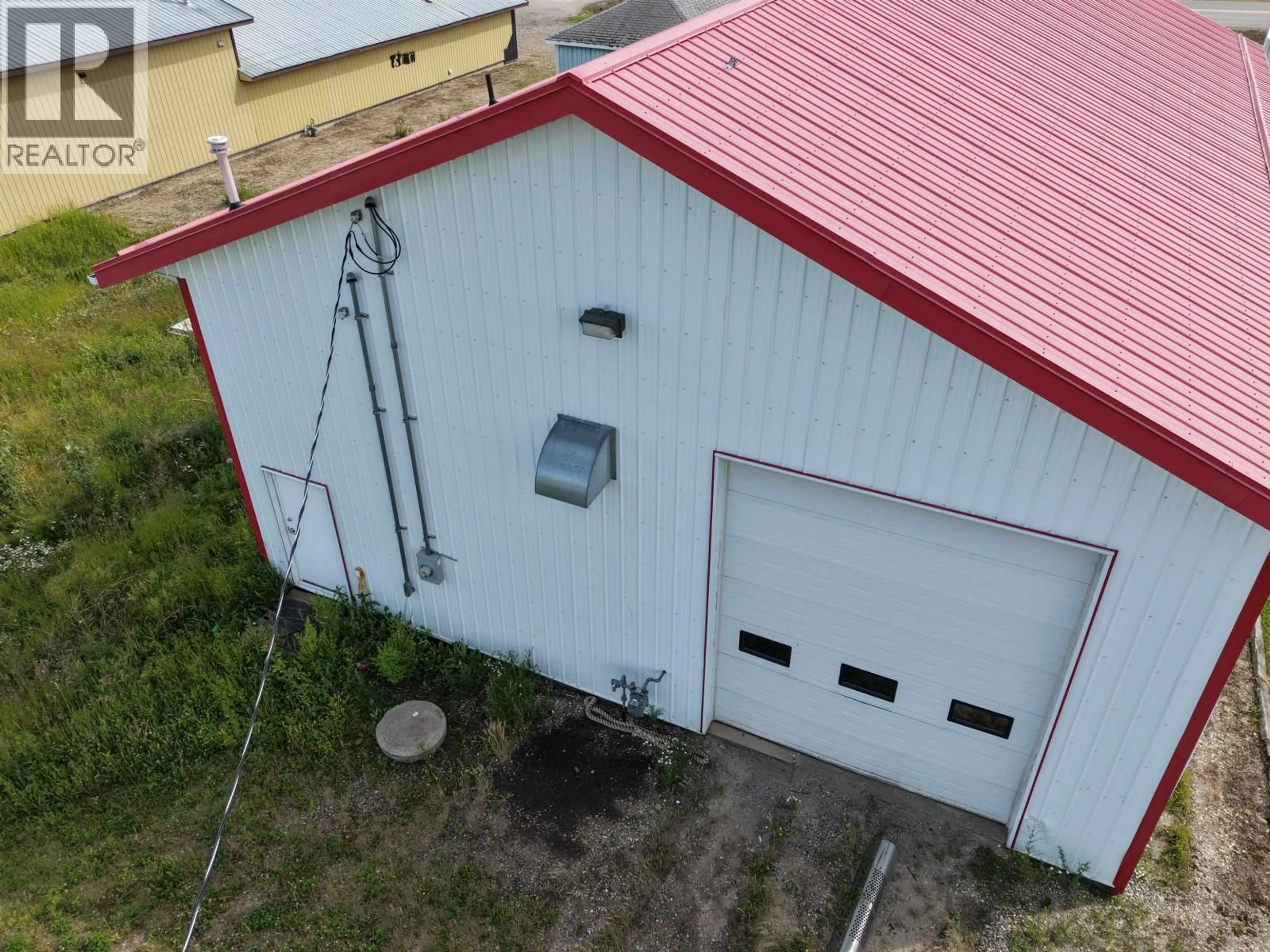A pic from outside/outdoor area/front of a property/back of a property/a pic from drone, building for 8354 100 AVENUE, Fort St. John British Columbia V1J1W6