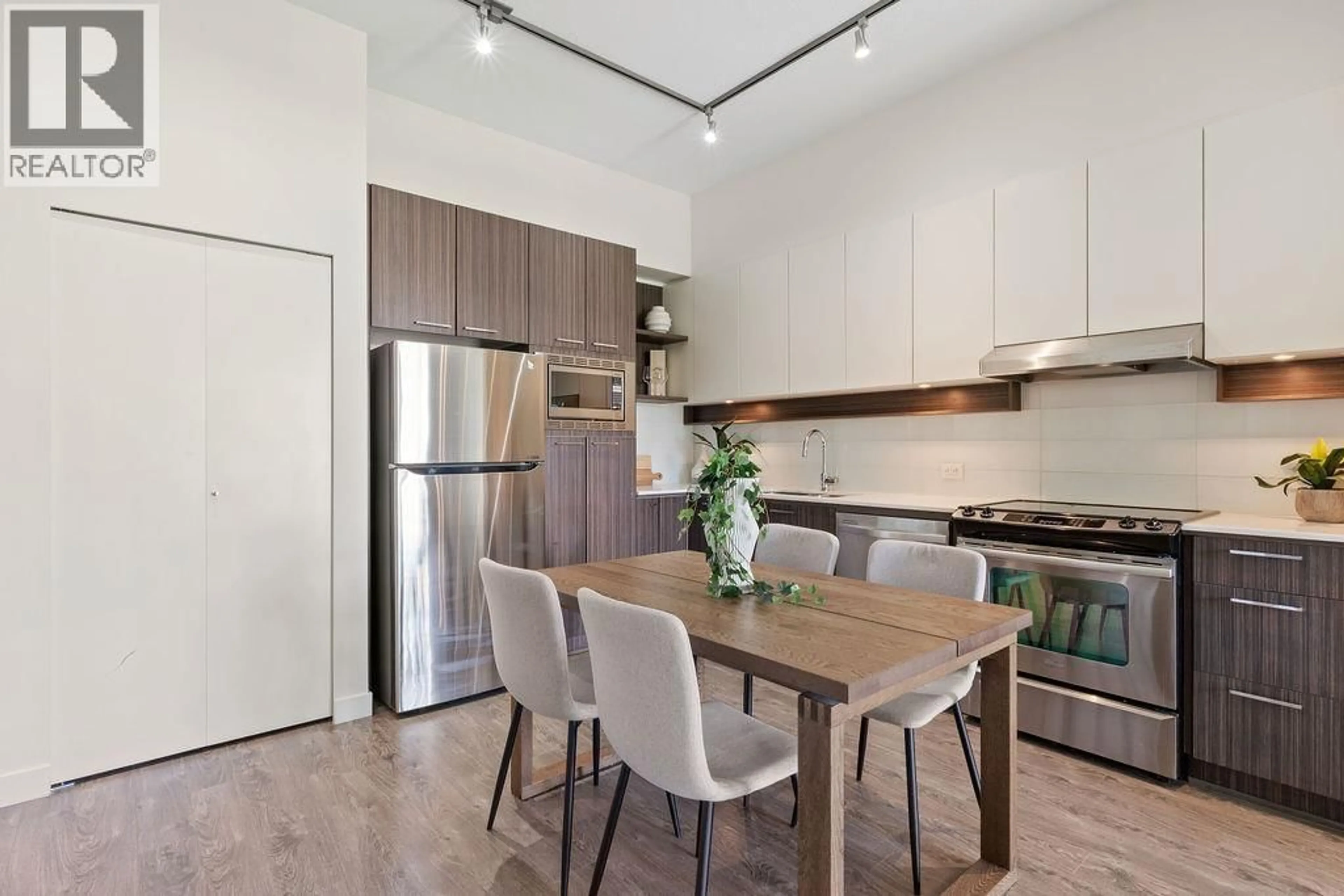 Open concept kitchen, wood/laminate floor for 408 - 555 FOSTER AVENUE, Coquitlam British Columbia V3J0B6