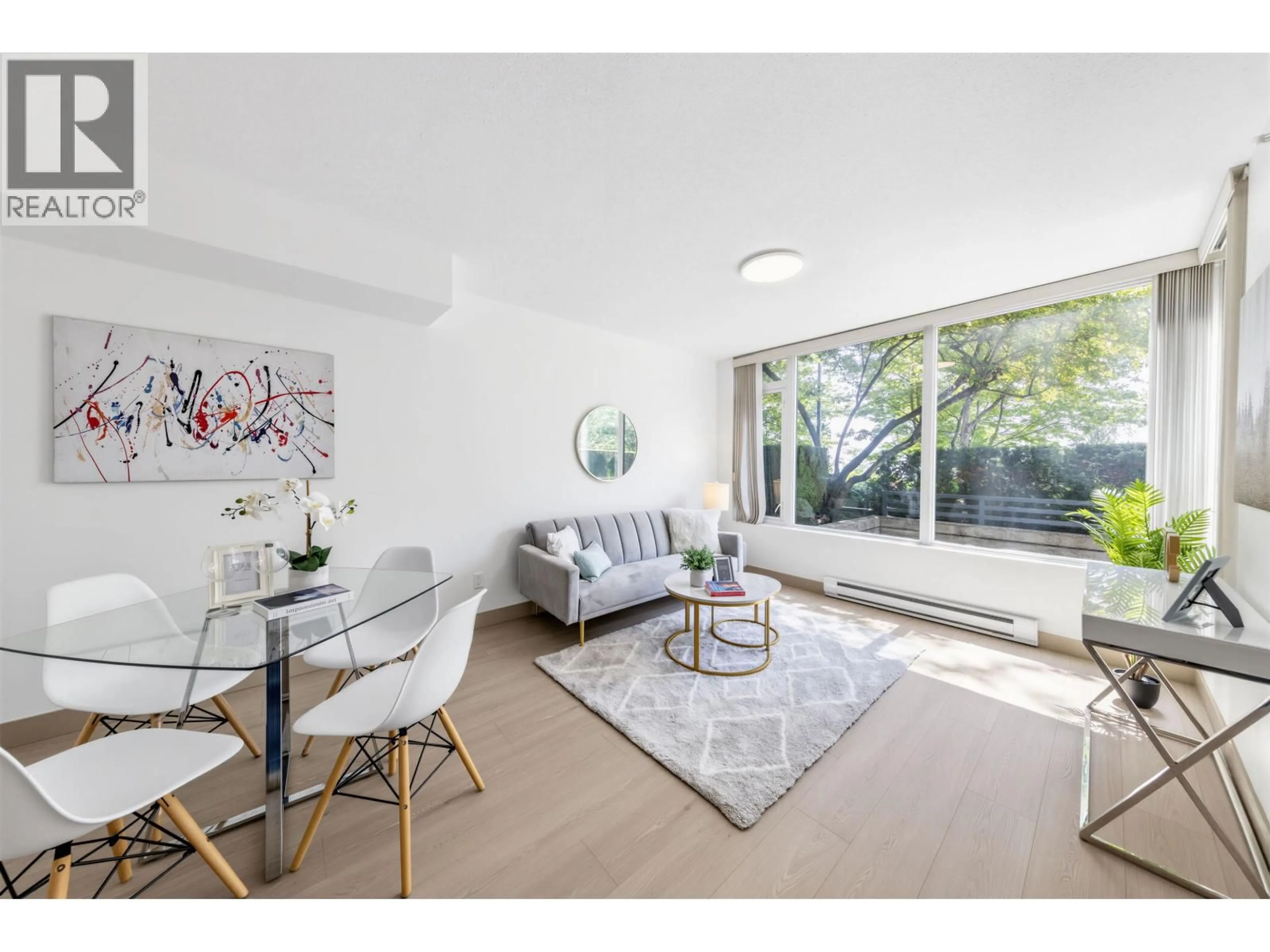 Living room with furniture, wood/laminate floor for 110 - 9009 CORNERSTONE MEWS, Burnaby British Columbia V5A0B9