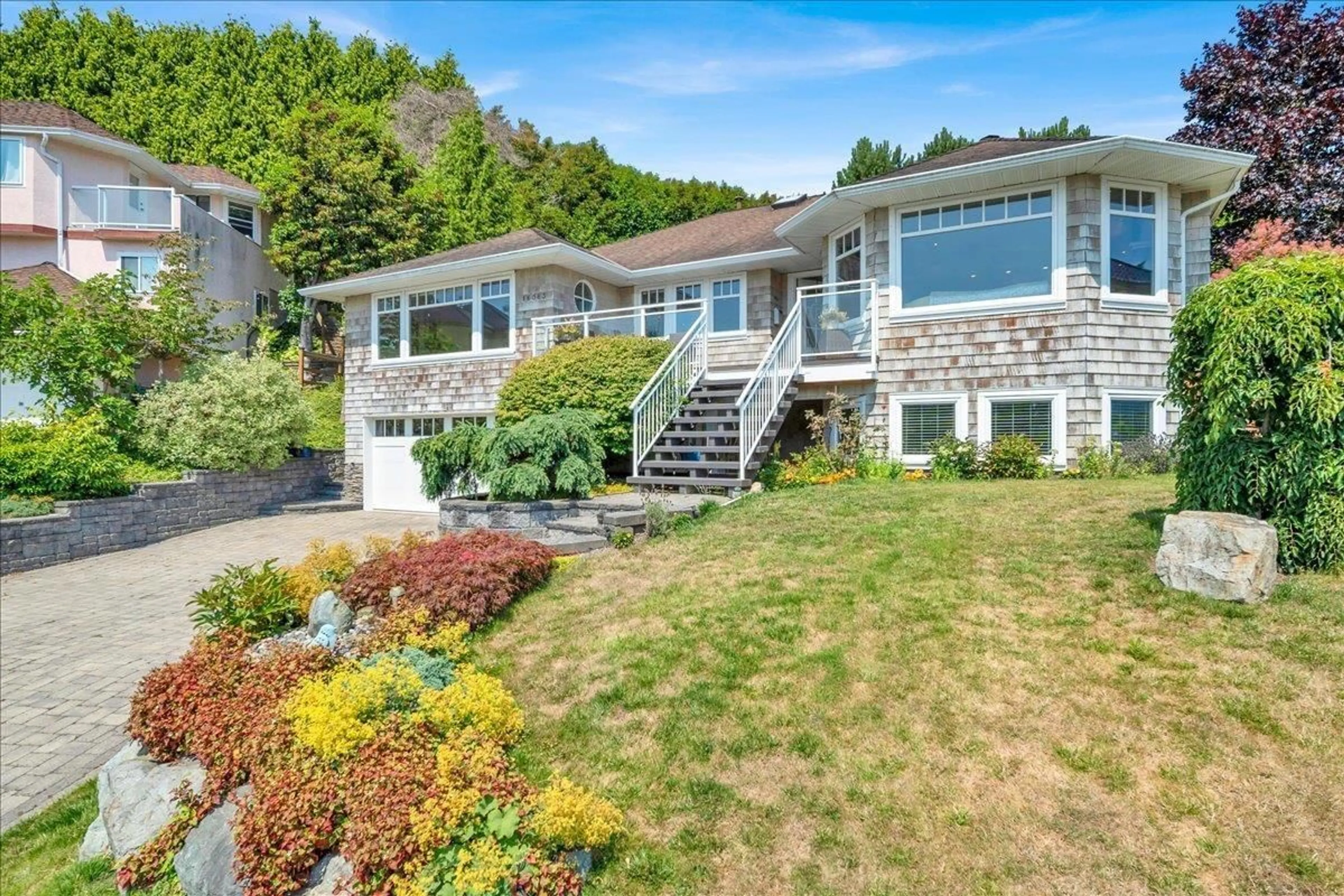 Home with vinyl exterior material, street for 16063 8 AVENUE, Surrey British Columbia V4A1A1
