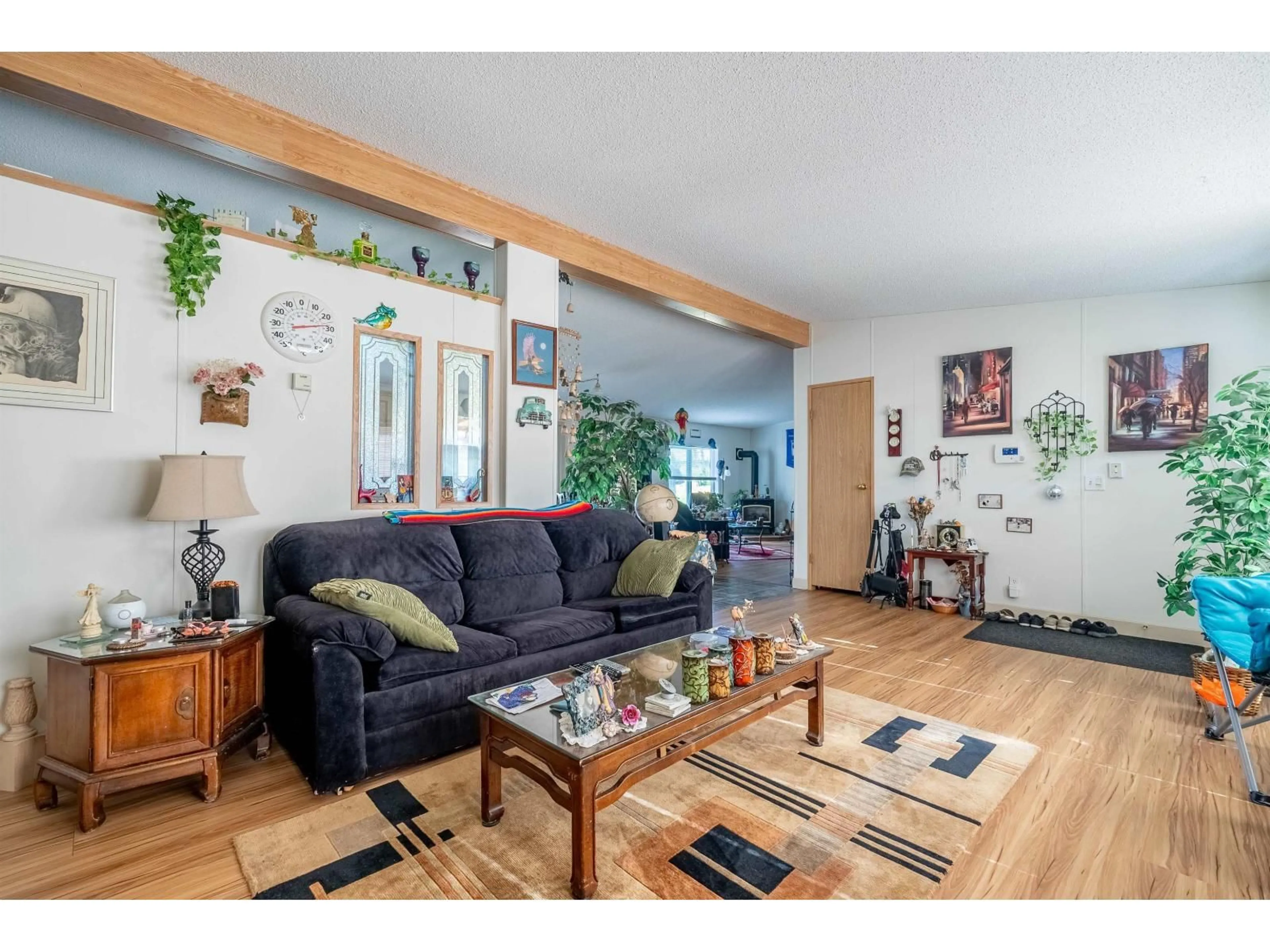 Living room with furniture, wood/laminate floor for 5316 216 STREET, Langley British Columbia V2Y1Y2