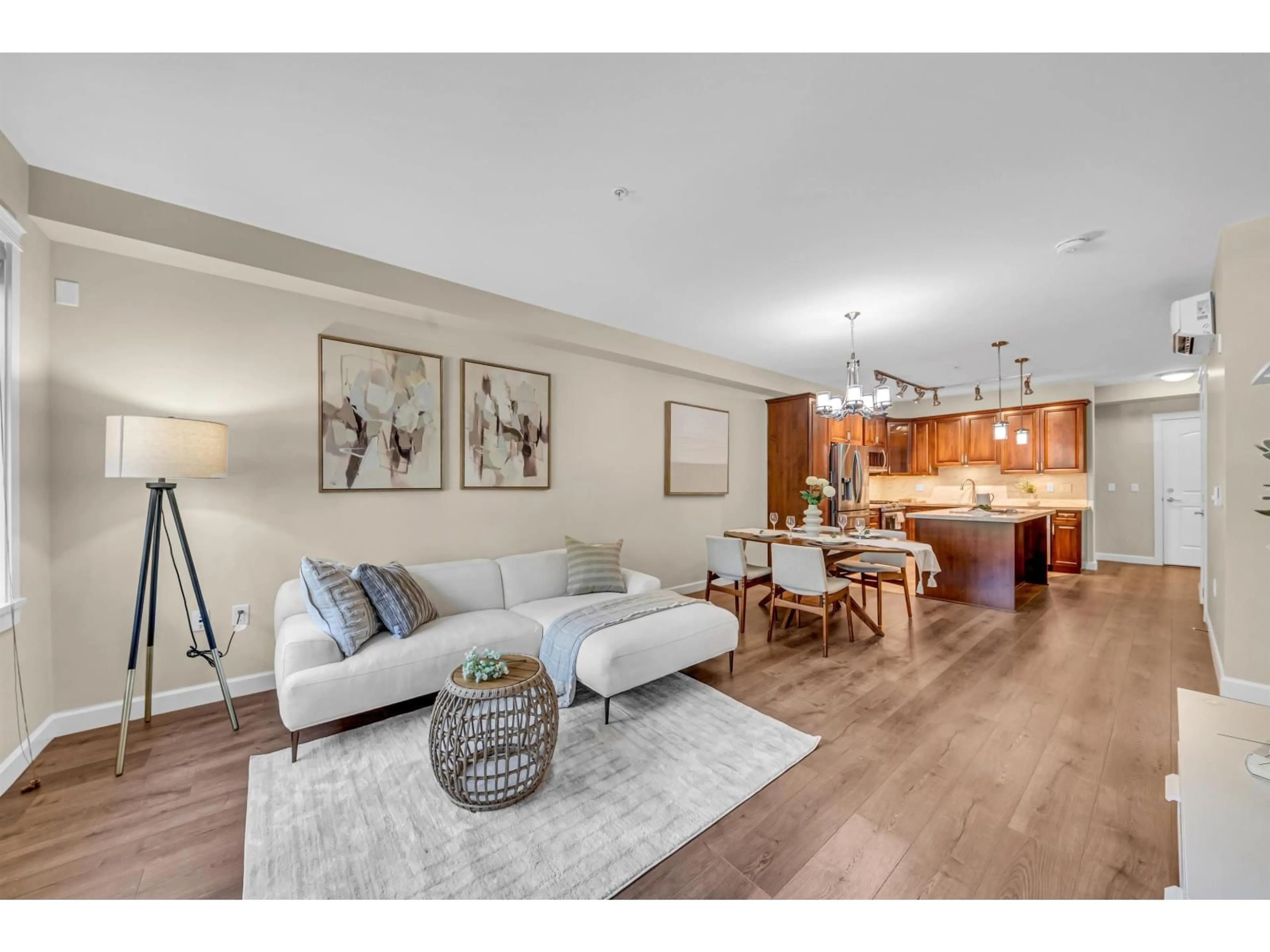 Living room with furniture, wood/laminate floor for 207 - 20325 85 AVENUE, Langley British Columbia V2Y3L2