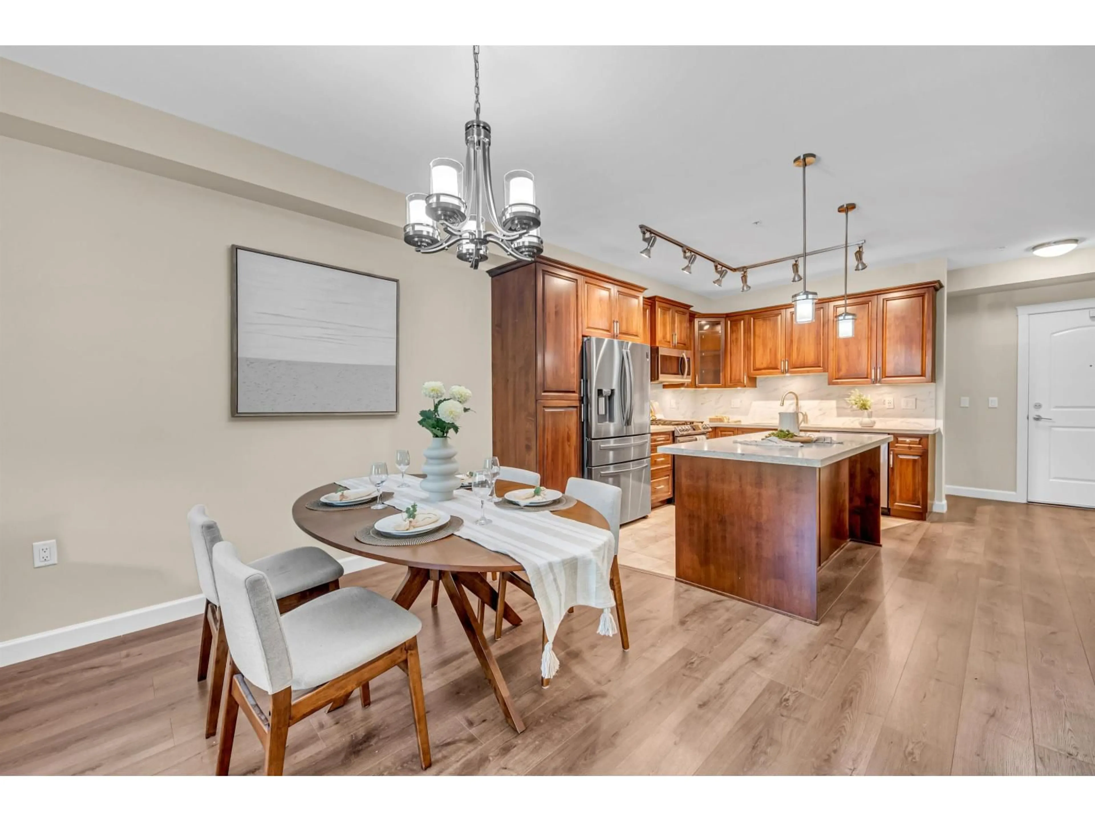 Open concept kitchen, wood/laminate floor for 207 - 20325 85 AVENUE, Langley British Columbia V2Y3L2