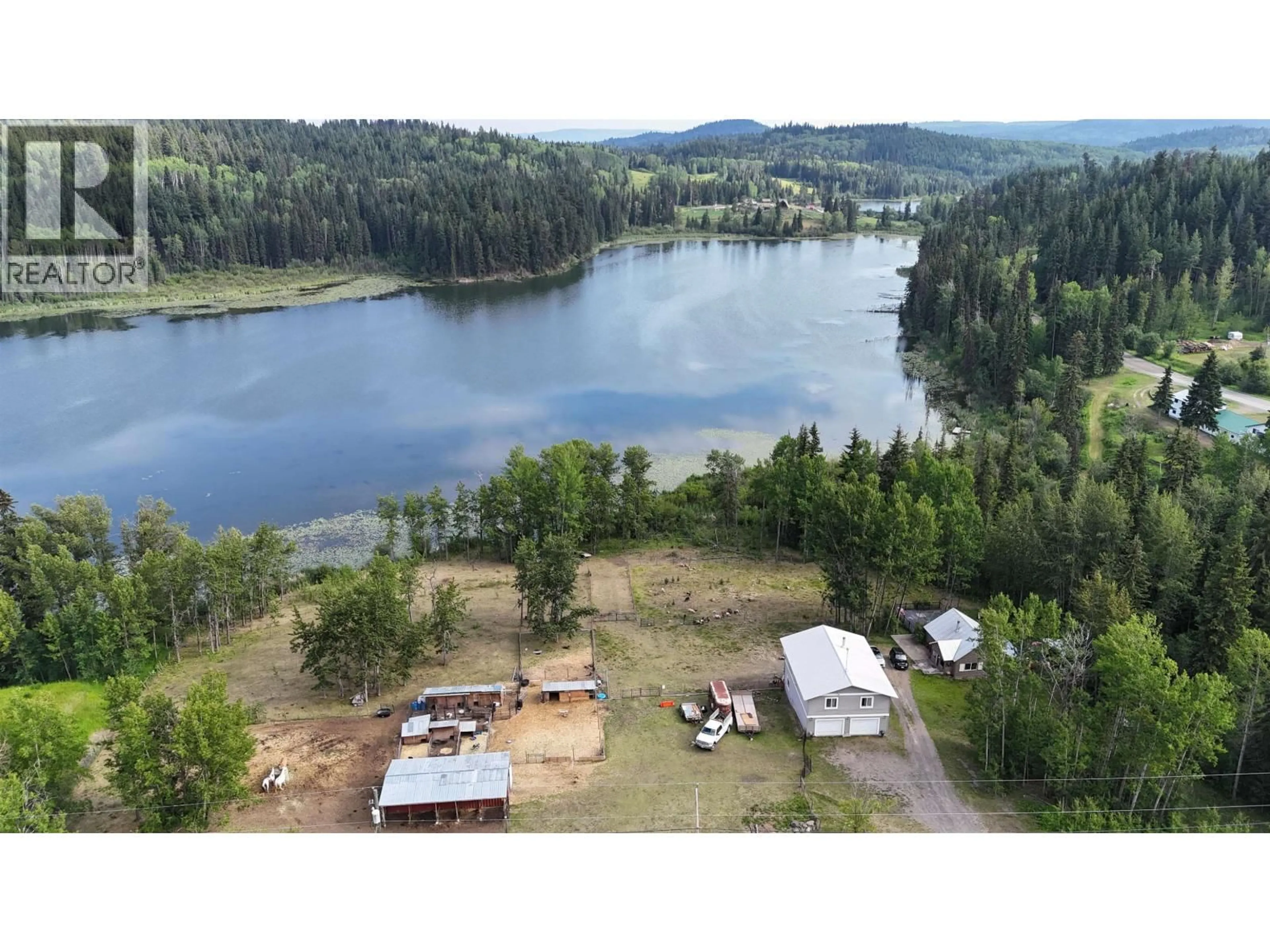 A pic from outside/outdoor area/front of a property/back of a property/a pic from drone, water/lake/river/ocean view for 7566 BRIDGE LAKE BUSINESS ROUTE, 100 Mile House British Columbia V0K1E0