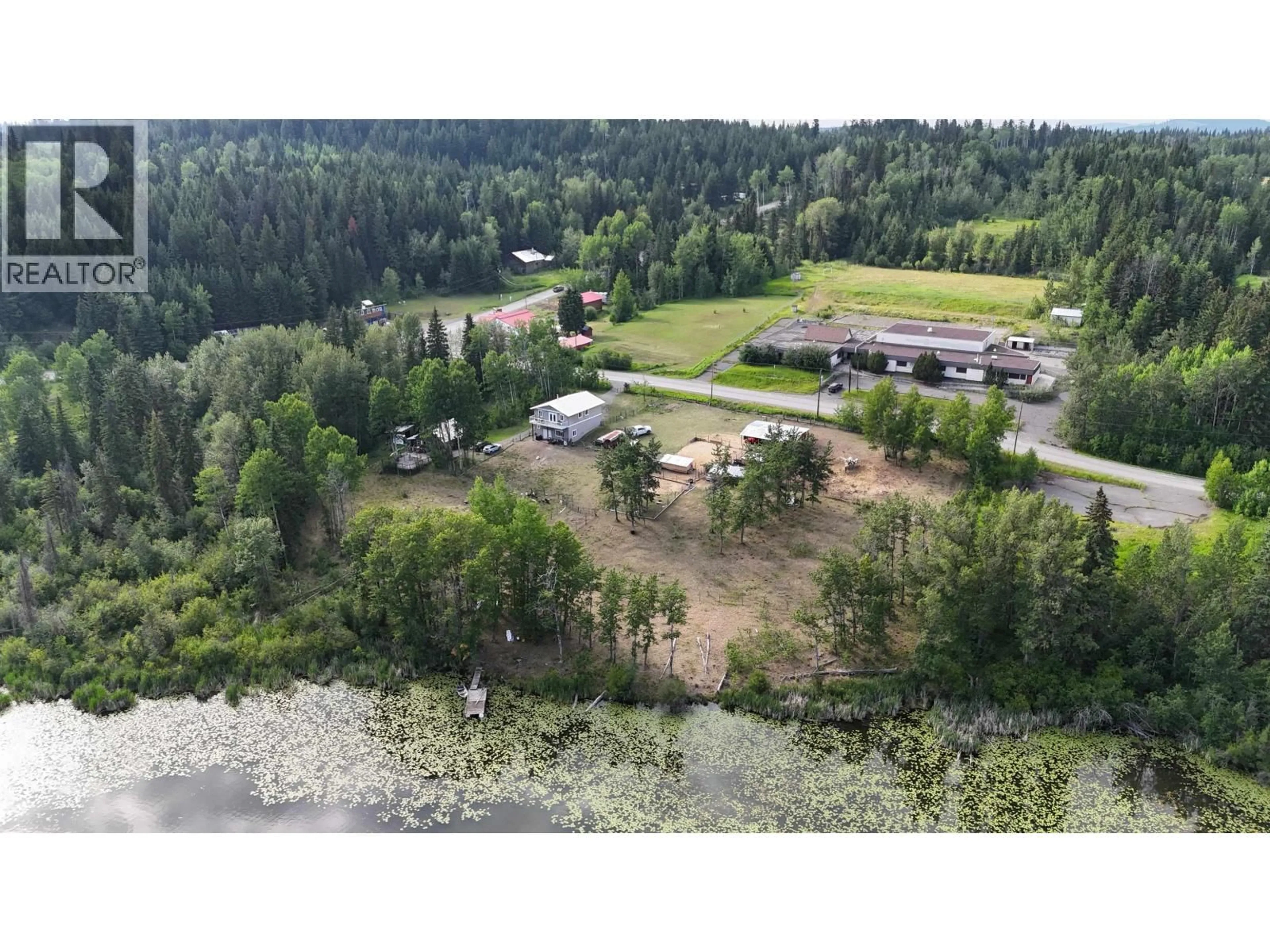 A pic from outside/outdoor area/front of a property/back of a property/a pic from drone, water/lake/river/ocean view for 7566 BRIDGE LAKE BUSINESS ROUTE, 100 Mile House British Columbia V0K1E0