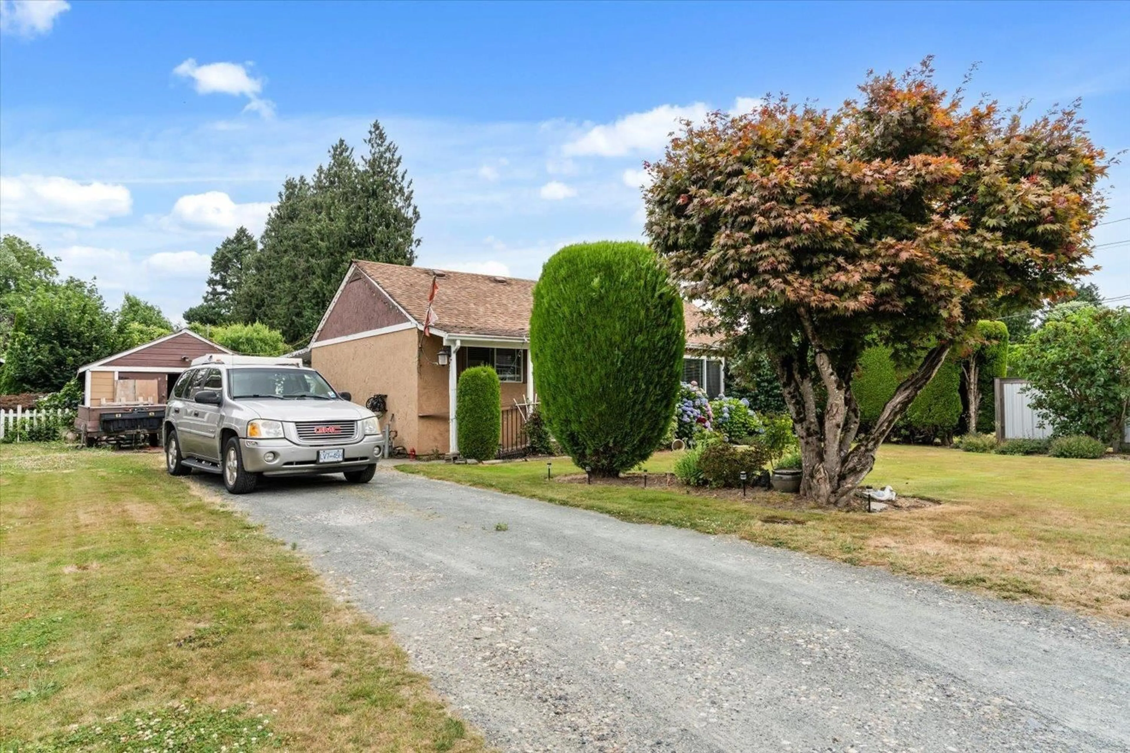 A pic from outside/outdoor area/front of a property/back of a property/a pic from drone, street for 46117 LEWIS AVENUE, Chilliwack British Columbia V2P3E2