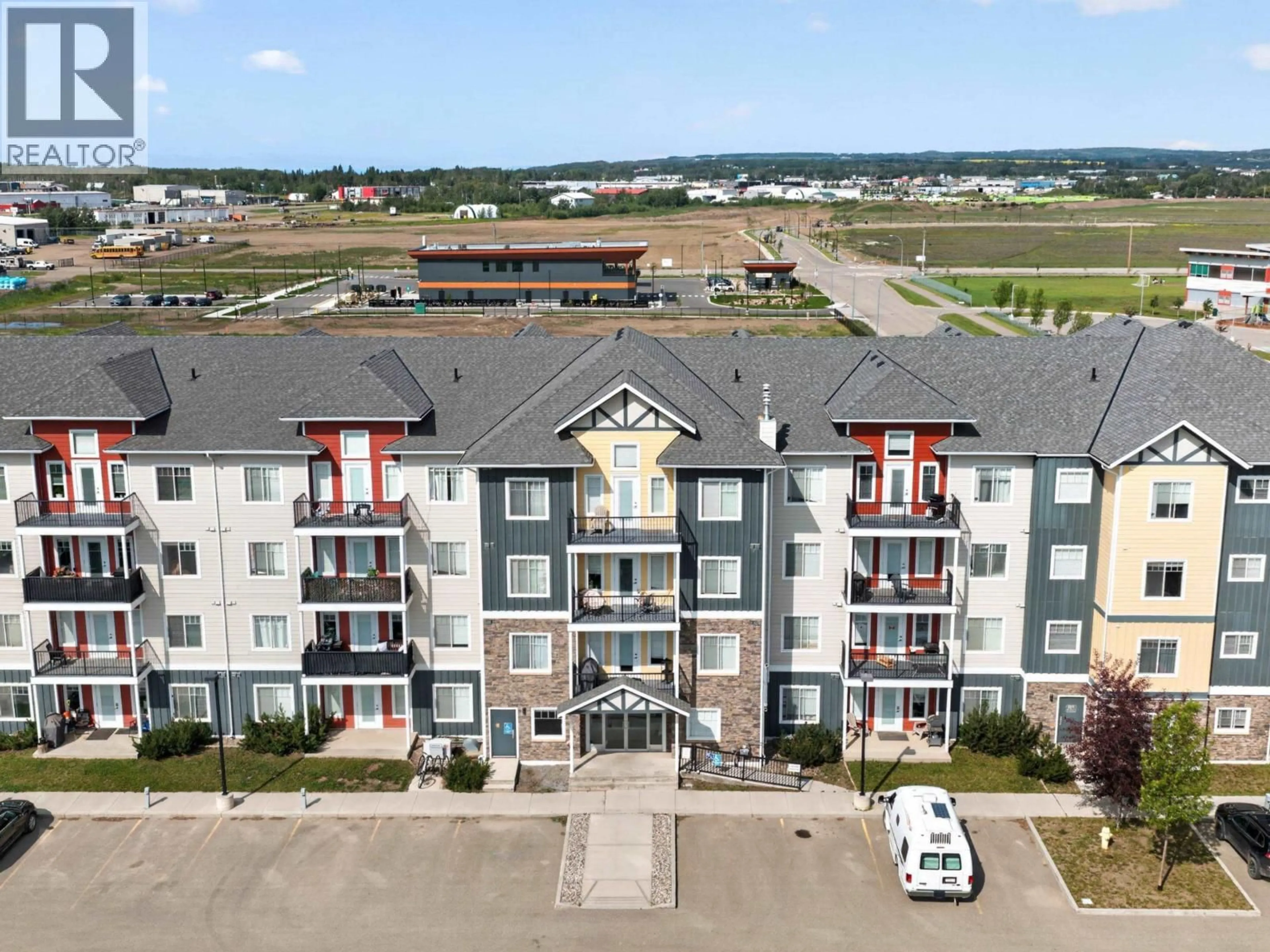 A pic from outside/outdoor area/front of a property/back of a property/a pic from drone, building for 402 - 11205 105 AVENUE, Fort St. John British Columbia V1J0L3