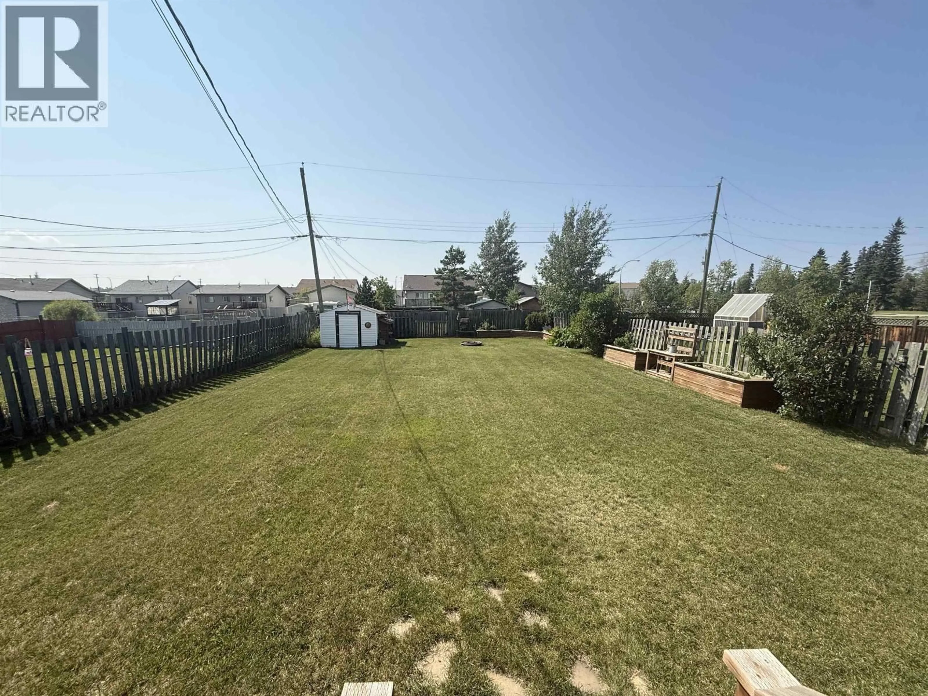 A pic from outside/outdoor area/front of a property/back of a property/a pic from drone, water/lake/river/ocean view for 8616 90 STREET, Fort St. John British Columbia V1J6S9