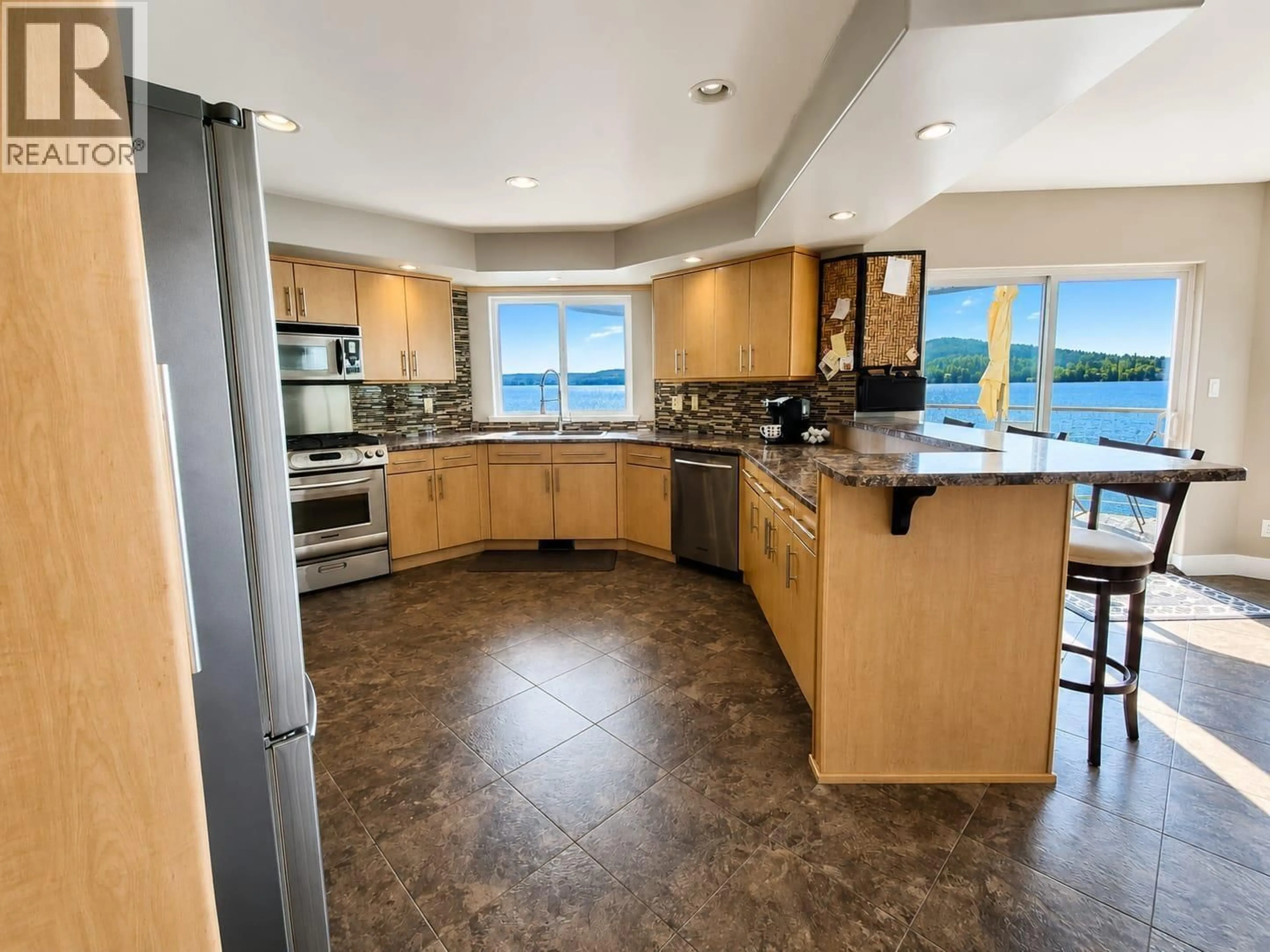 Open concept kitchen, ceramic/tile floor for 8569 SKYLINE DRIVE, 70 Mile House British Columbia V0K2K0