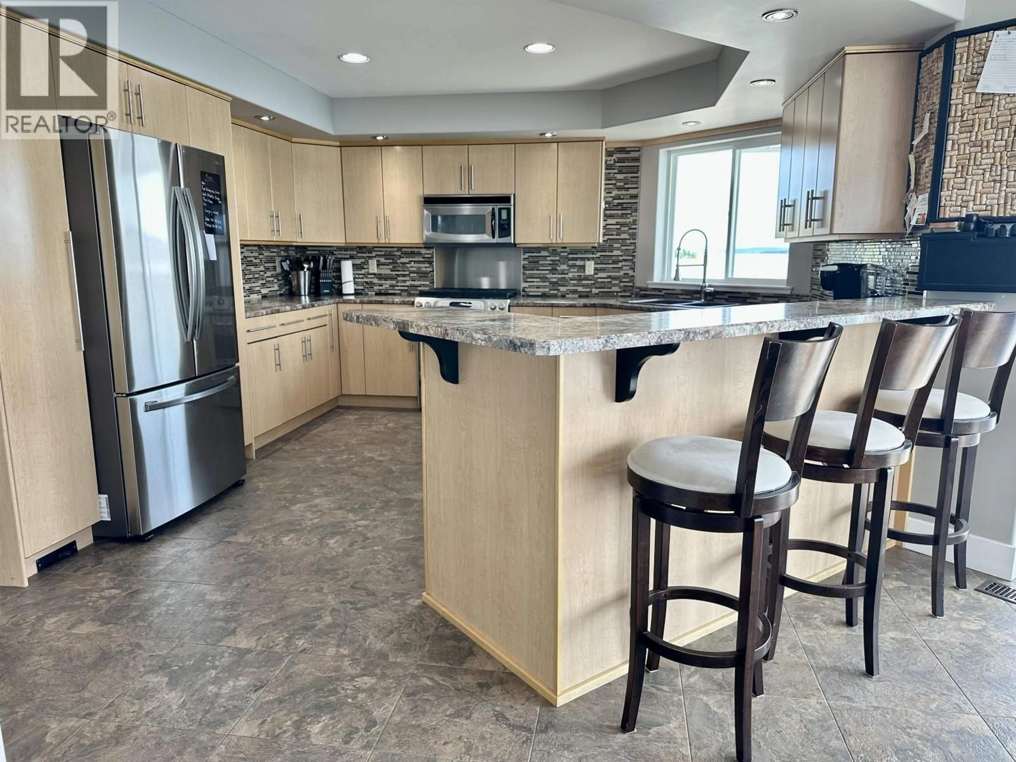 Open concept kitchen, ceramic/tile floor for 8569 SKYLINE DRIVE, 70 Mile House British Columbia V0K2K0
