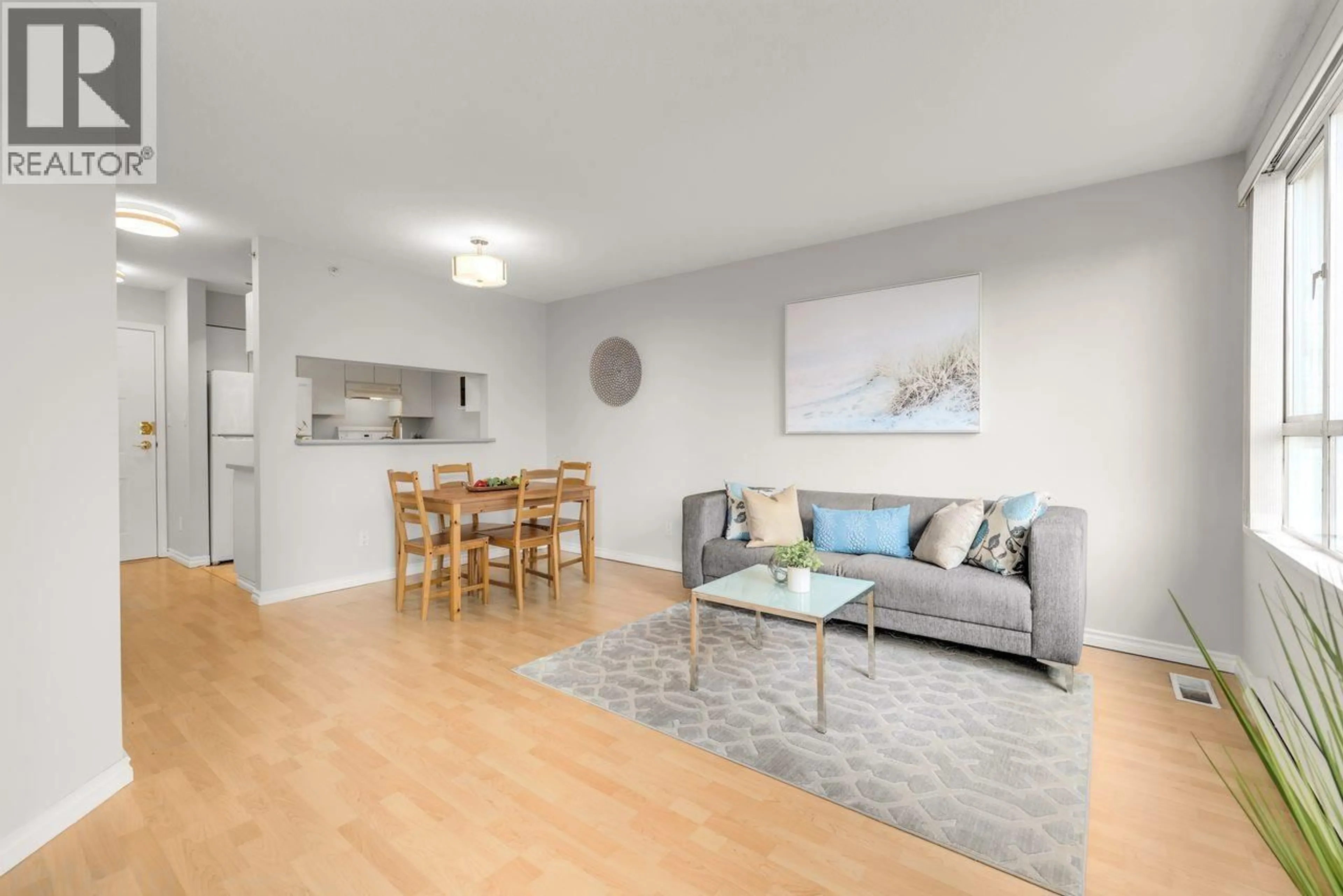 Living room with furniture, wood/laminate floor for 912 - 3455 ASCOT PLACE, Vancouver British Columbia V5R6B7