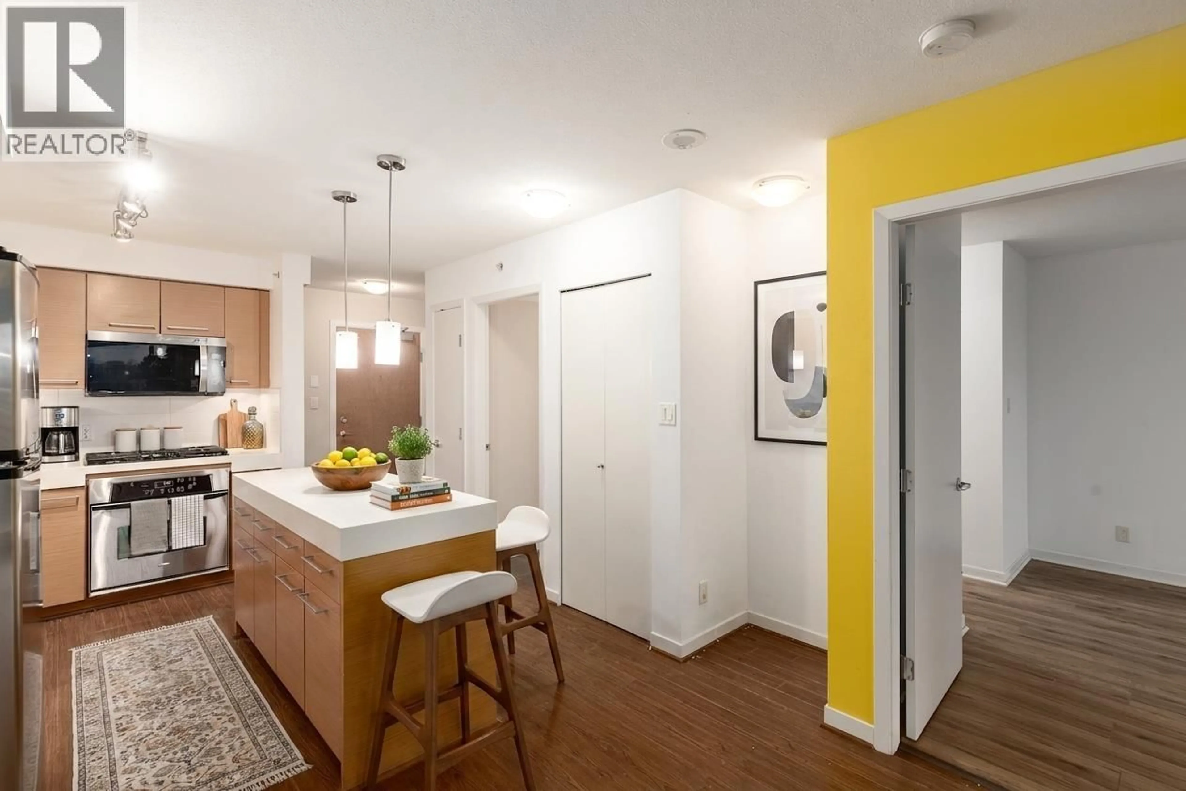 Open concept kitchen, wood/laminate floor for 408 - 2770 SOPHIA STREET, Vancouver British Columbia V5T0A4