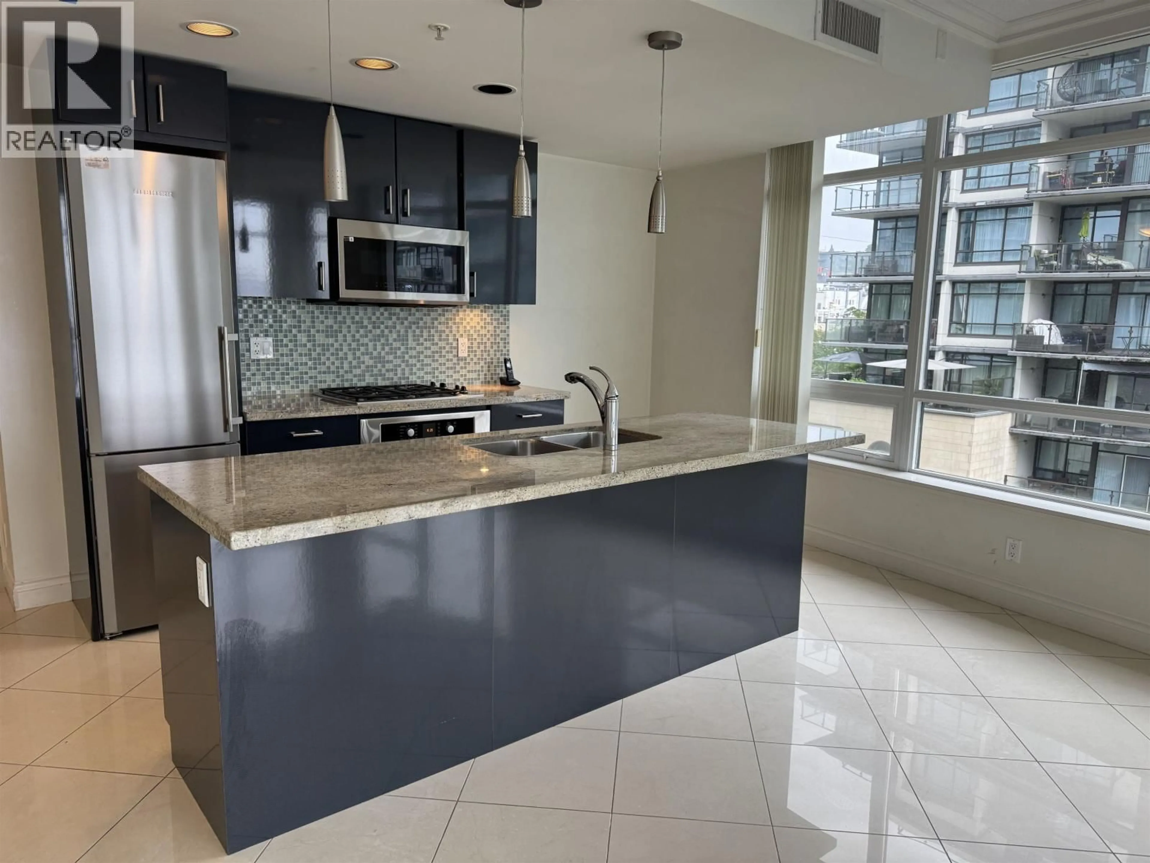 Open concept kitchen, ceramic/tile floor for 604 - 162 VICTORY SHIP WAY, North Vancouver British Columbia V7L0B4