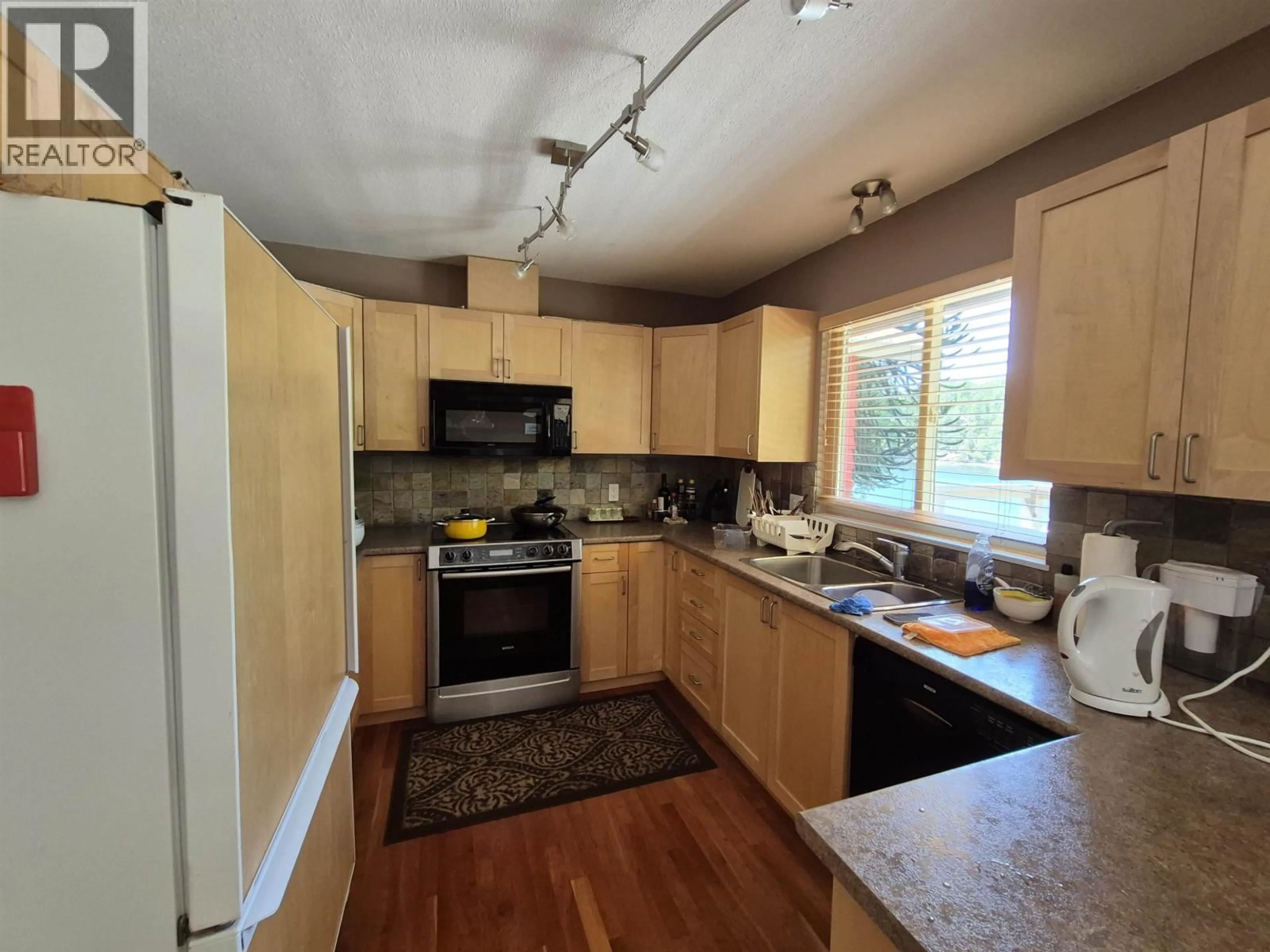 Standard kitchen, wood/laminate floor for 13175 PORTERS ROAD, Pender Harbour British Columbia V0N2H1