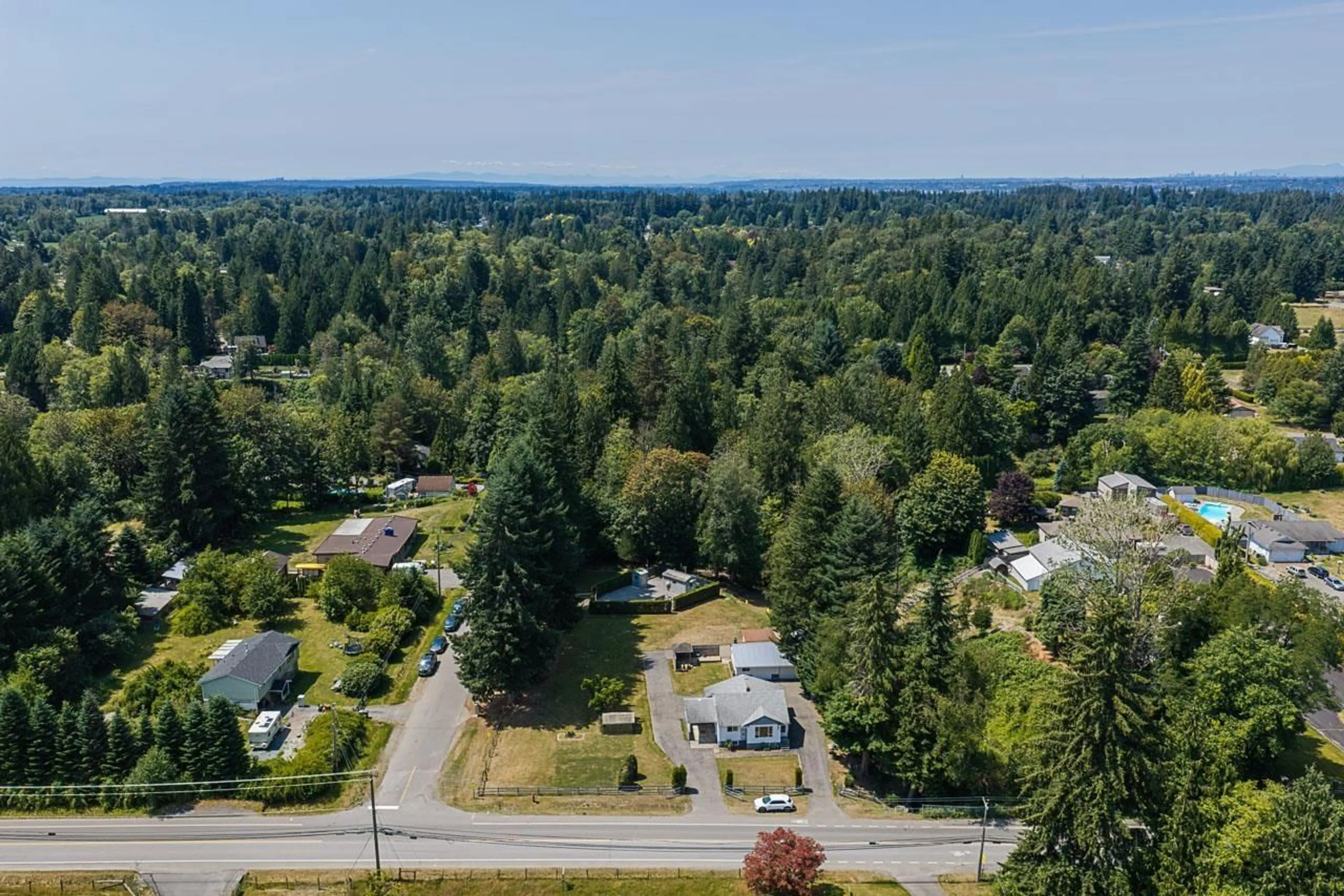 A pic from outside/outdoor area/front of a property/back of a property/a pic from drone, forest/trees view for 4821 248 STREET, Langley British Columbia V4W1C8