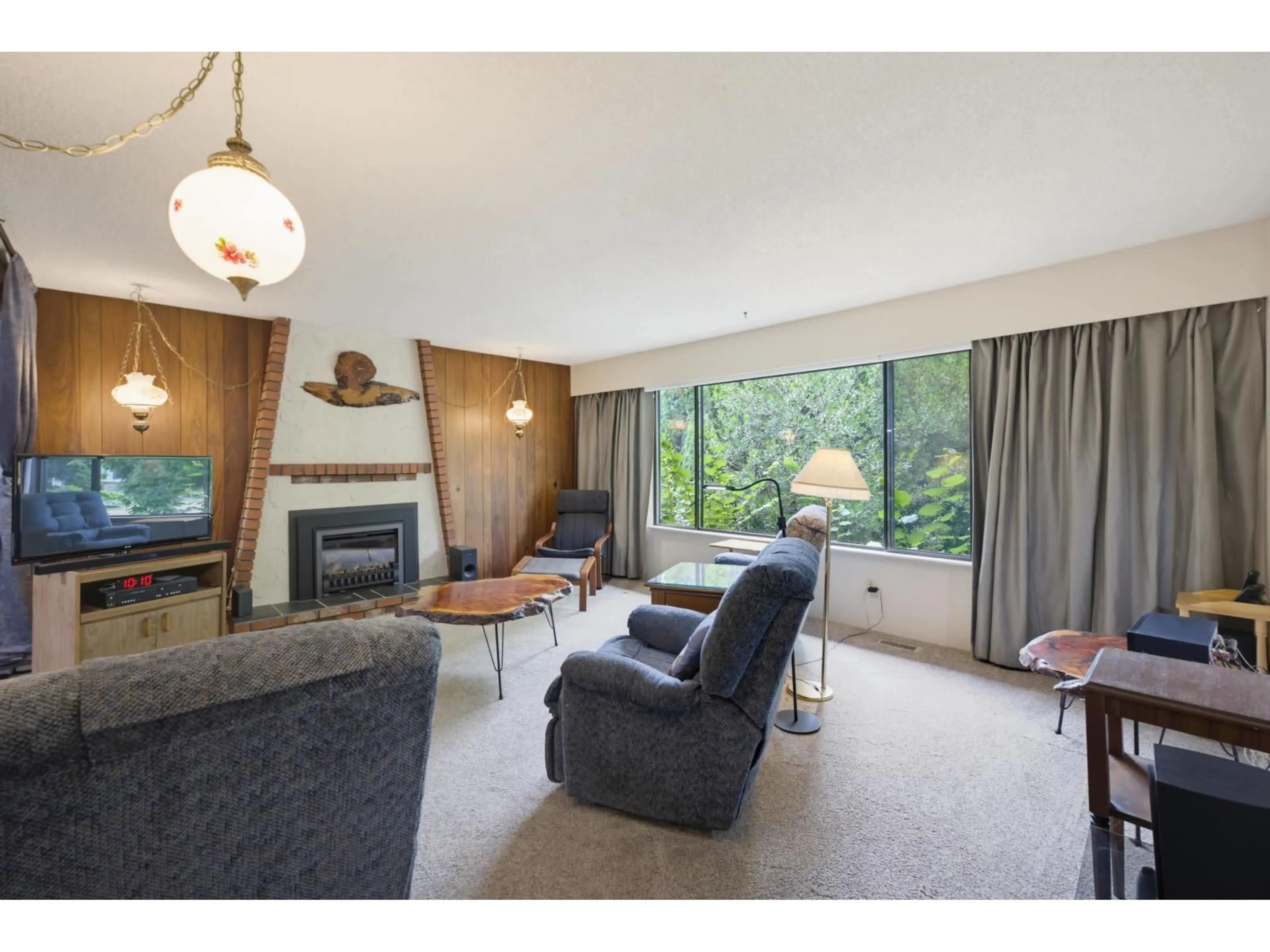 Living room with furniture, wood/laminate floor for 4611 203A STREET, Langley British Columbia V3A5W2