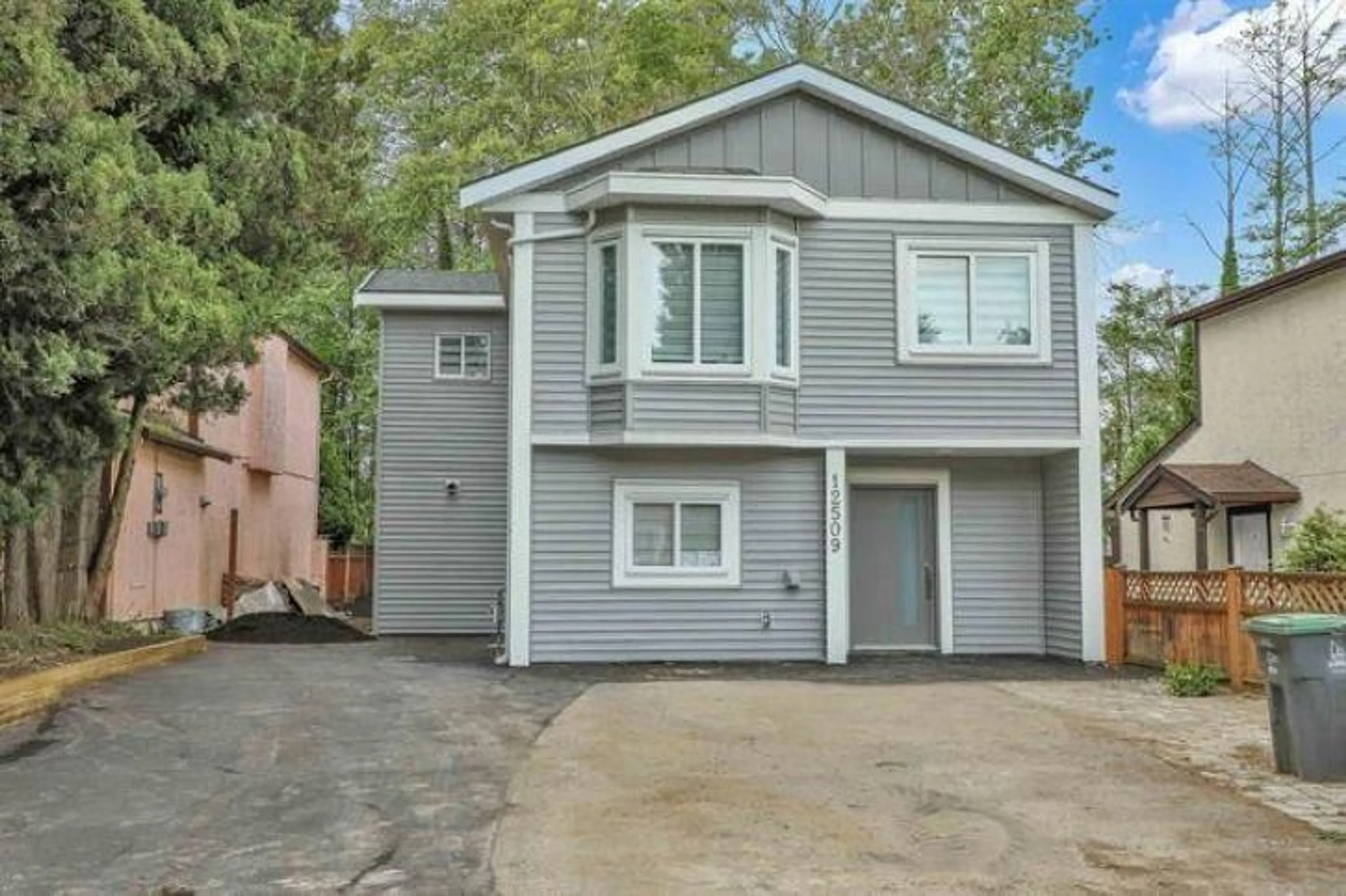 Home with vinyl exterior material, street for 12509 77B AVENUE, Surrey British Columbia V3W8L9