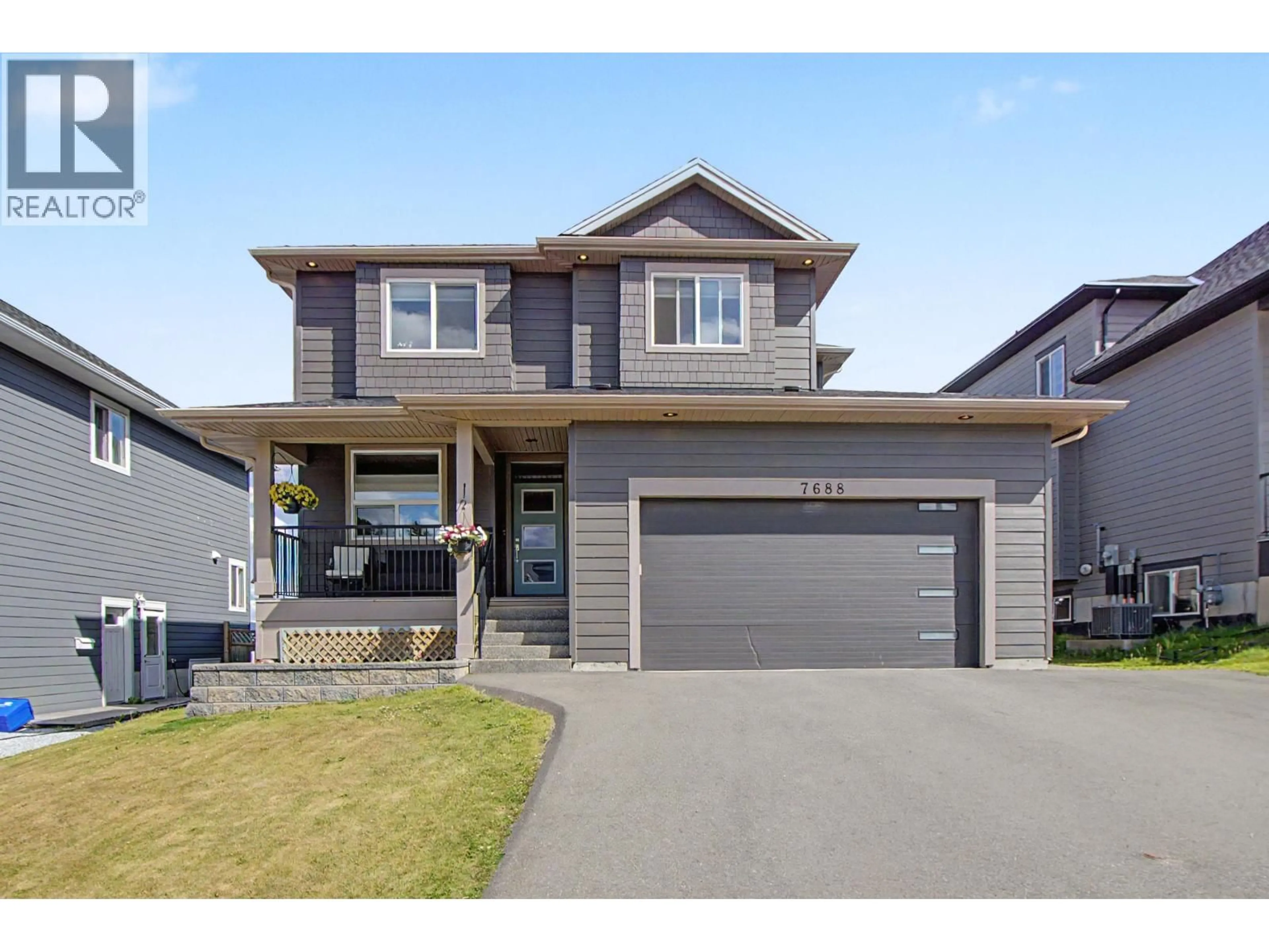 Home with vinyl exterior material, street for 7688 SOUTHRIDGE AVENUE, Prince George British Columbia V2N6S4