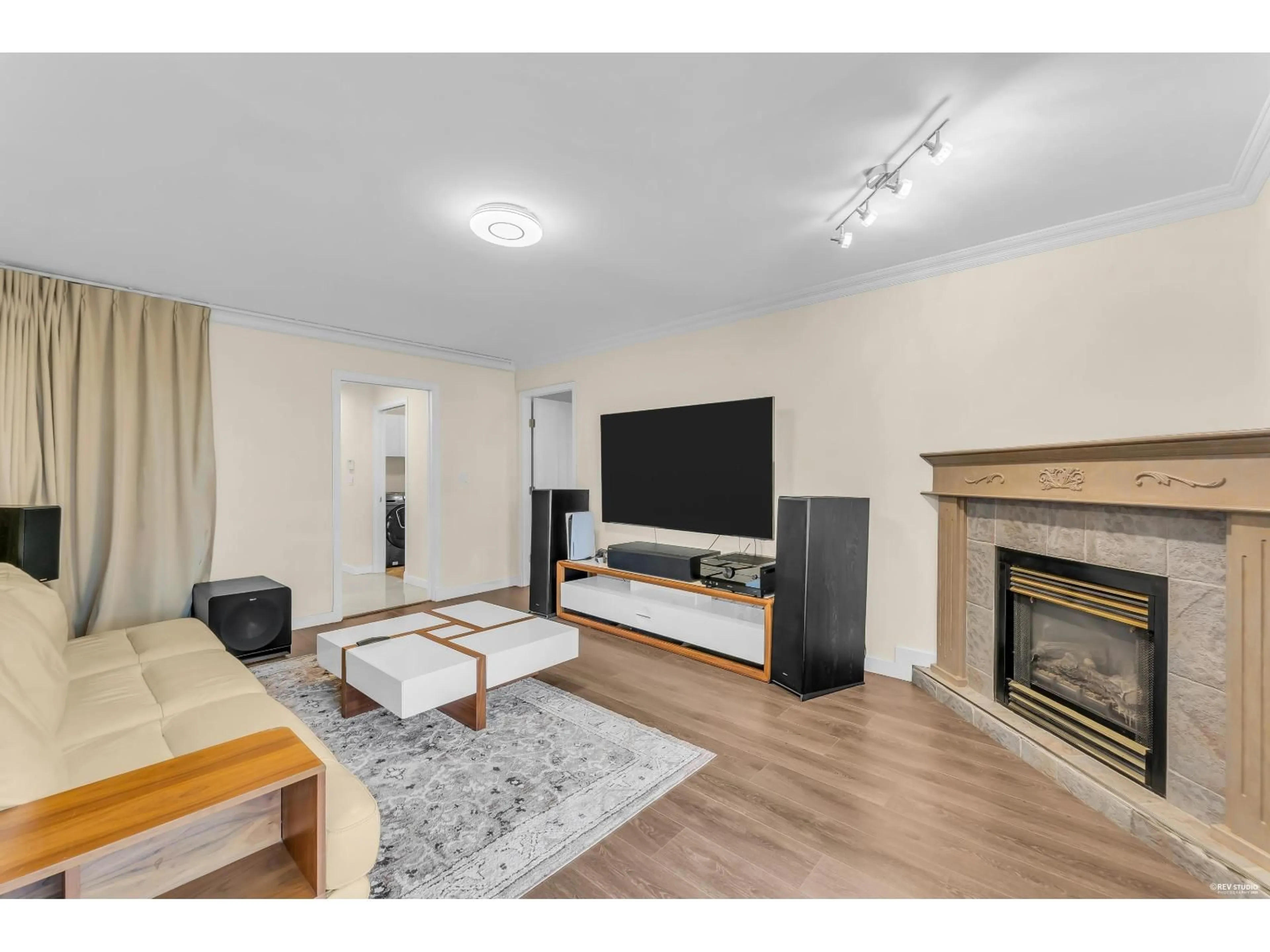 Living room with furniture, wood/laminate floor for 7882 165A STREET, Surrey British Columbia V3S7V3