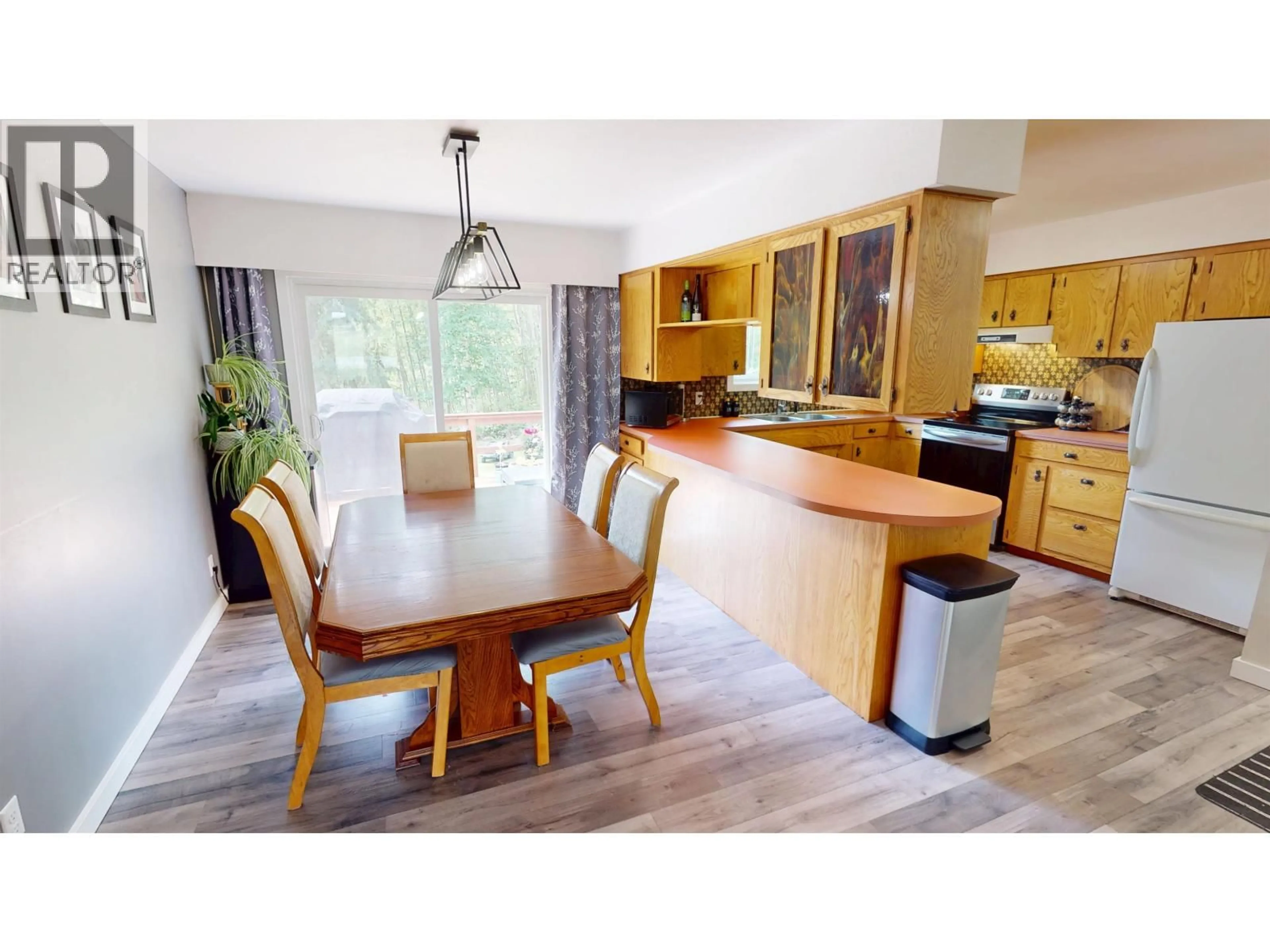 Open concept kitchen, wood/laminate floor for 2611 GOOK ROAD, Quesnel British Columbia V2J4H8