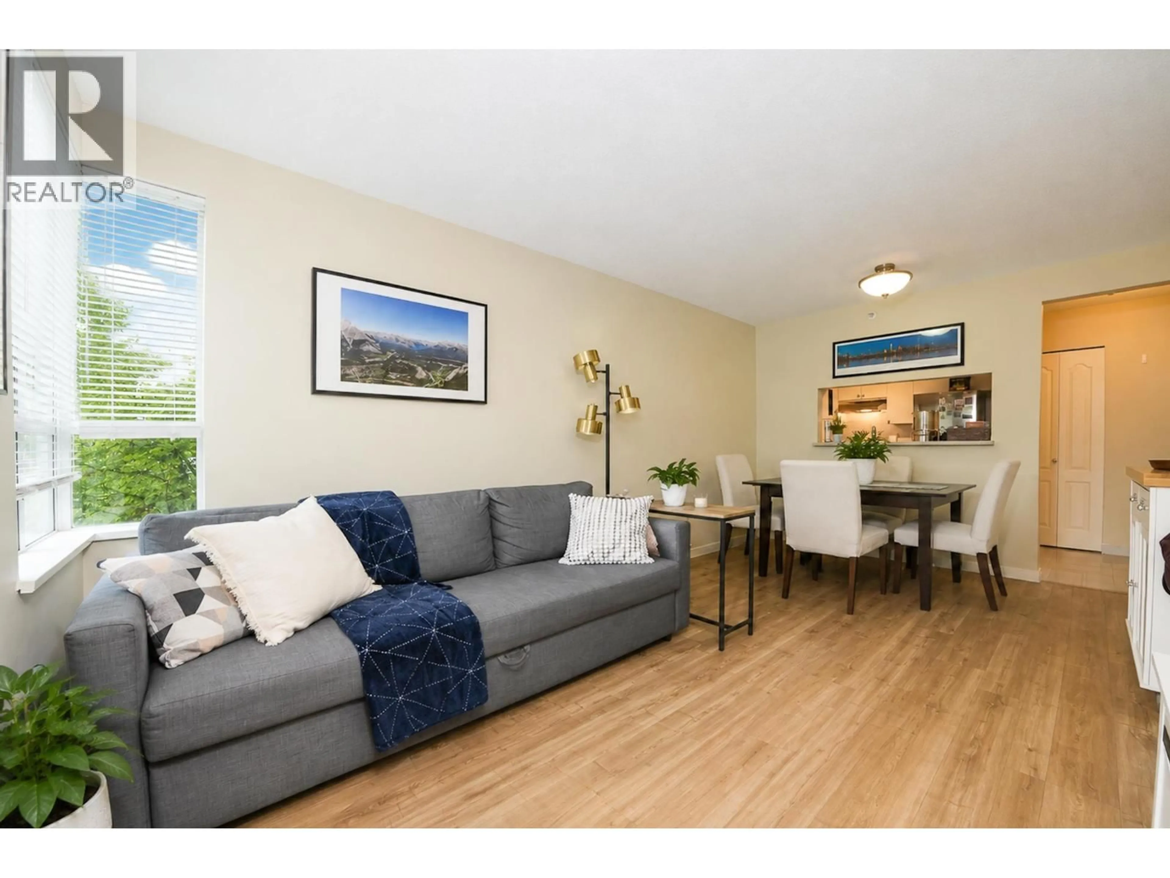 Living room with furniture, wood/laminate floor for 305 - 3489 ASCOT PLACE, Vancouver British Columbia V5R6B6
