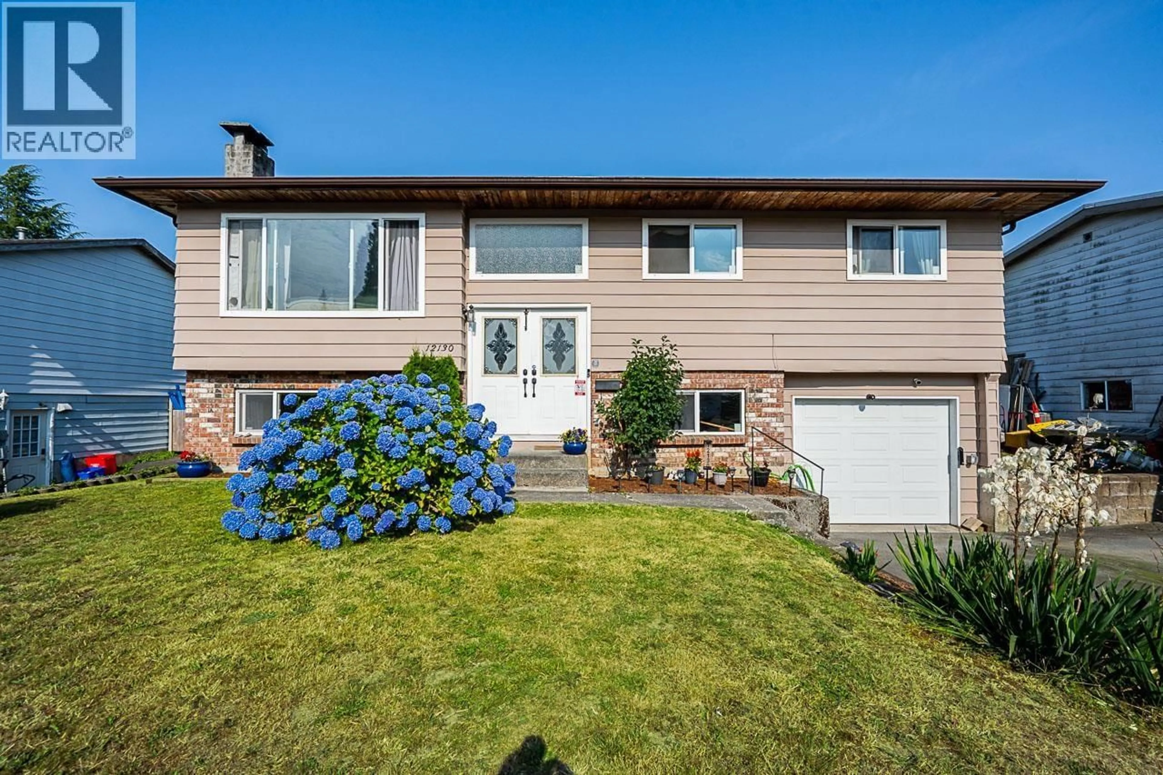 Home with vinyl exterior material, street for 12130 229TH STREET, Maple Ridge British Columbia V2X7M8