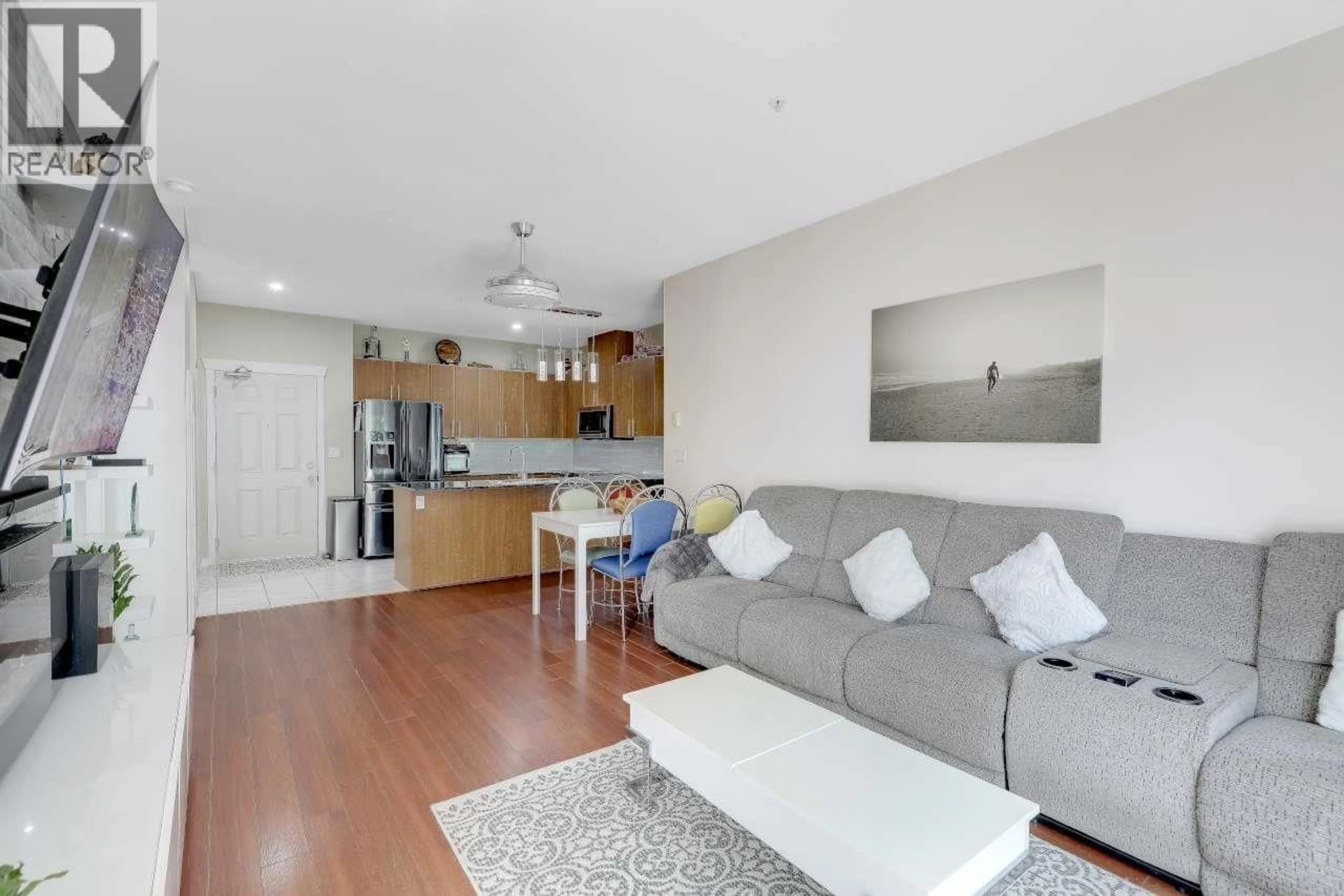 Living room with furniture, wood/laminate floor for 208 - 2488 KELLY AVENUE, Port Coquitlam British Columbia V3C1Y4