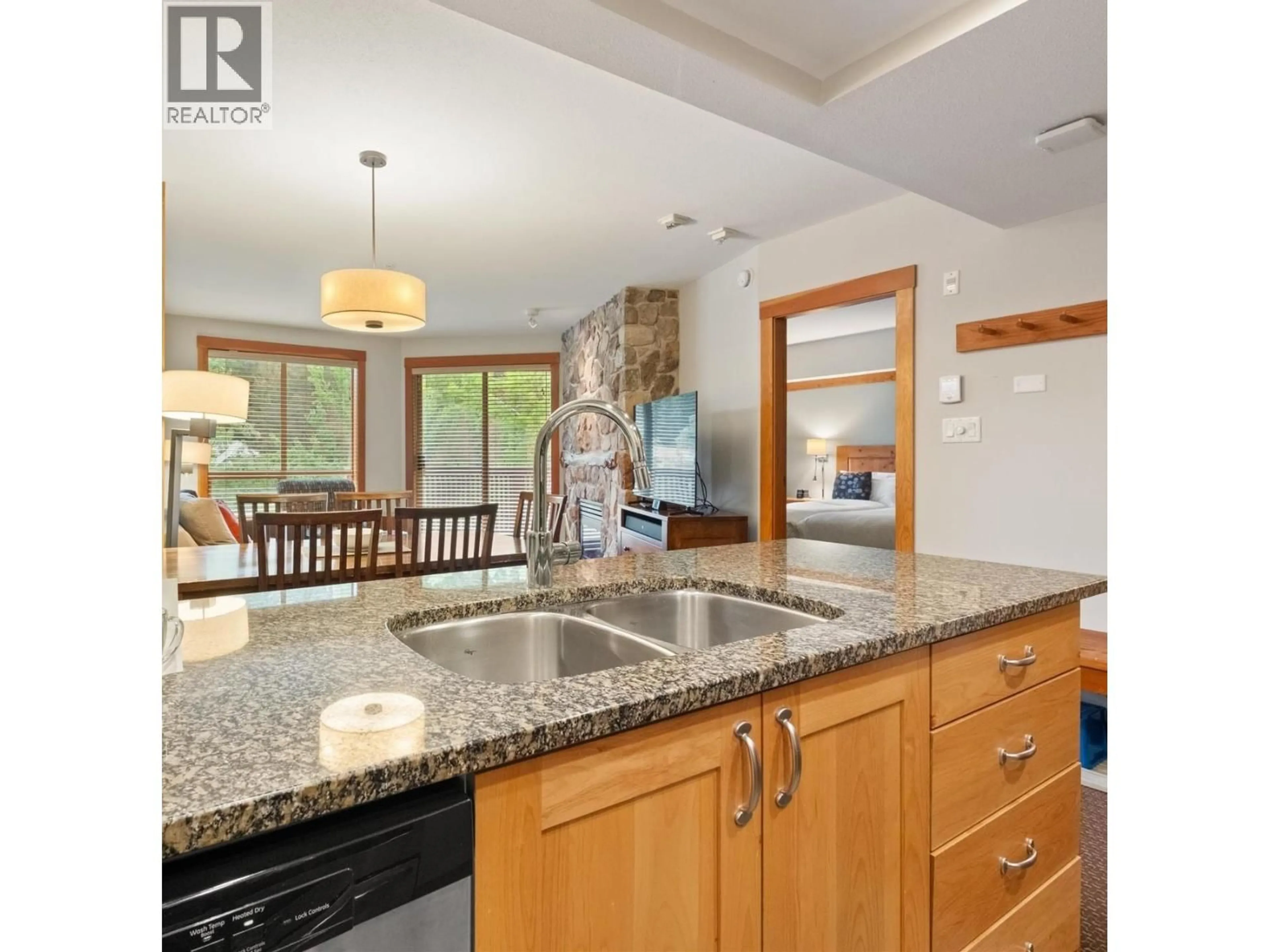 Open concept kitchen, ceramic/tile floor for 422 - 2036 LONDON LANE, Whistler British Columbia V8E0N7