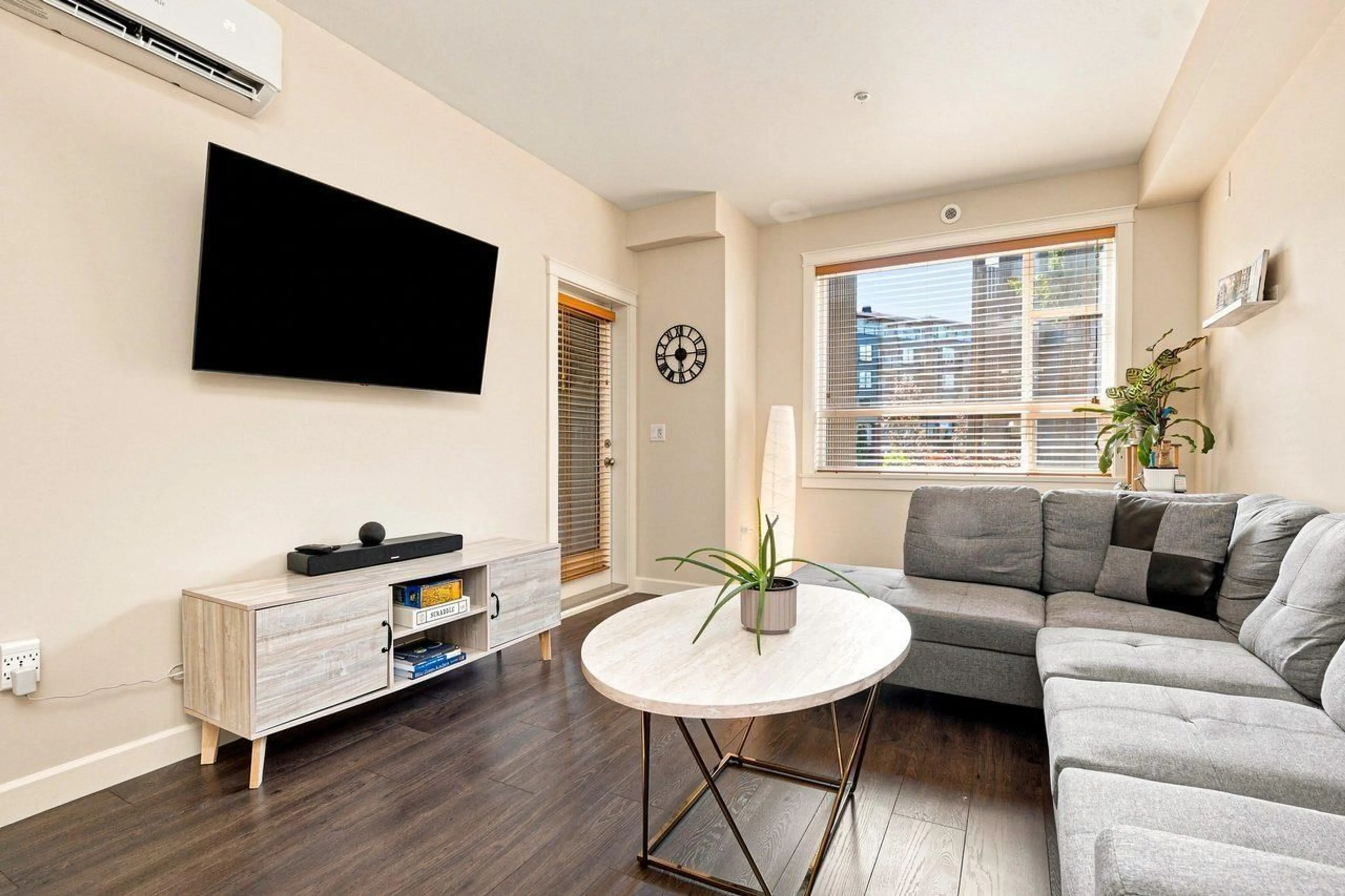 Living room with furniture, wood/laminate floor for 303 - 3585 146A STREET, Surrey British Columbia V4P0G9