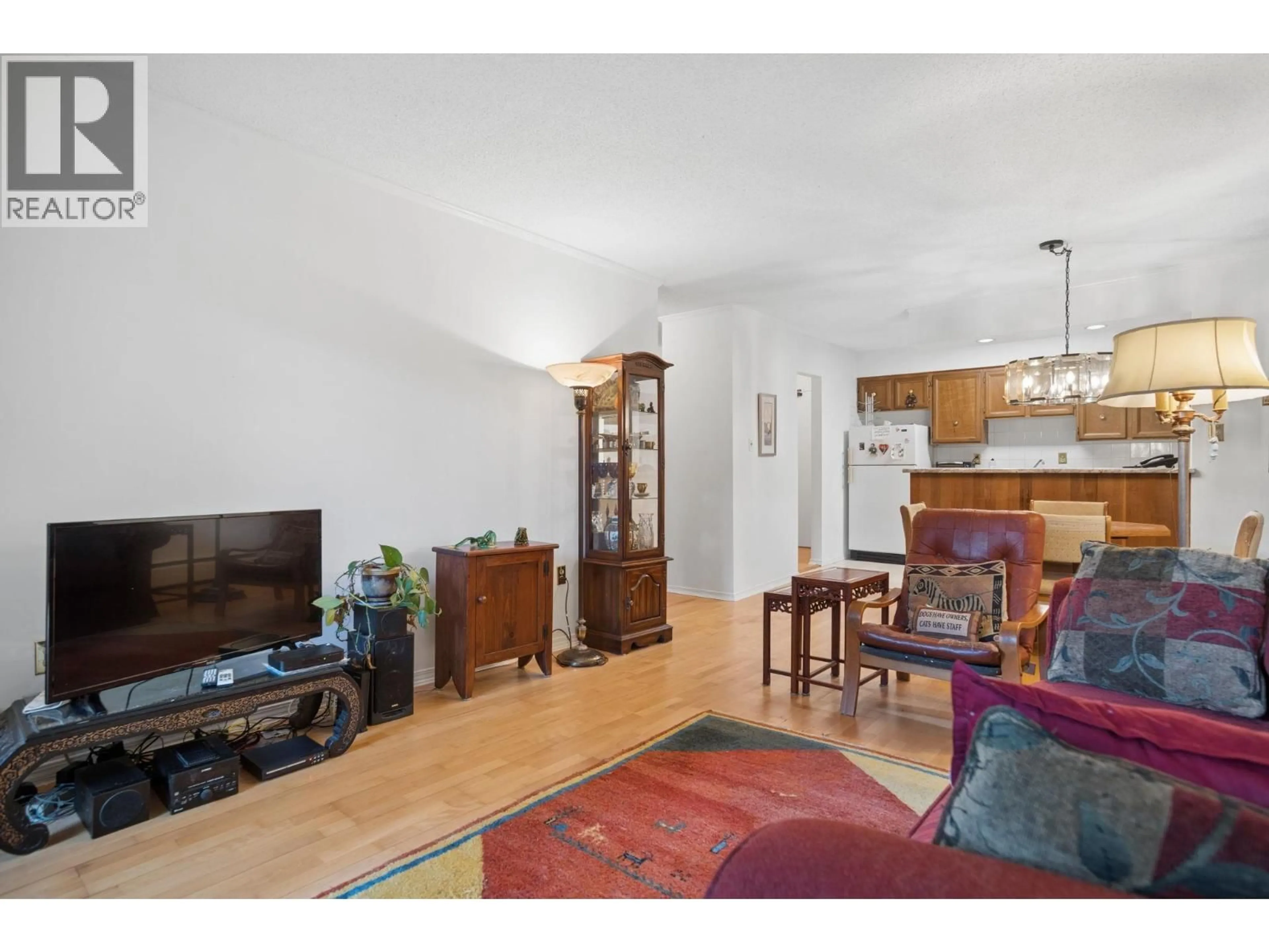 Living room with furniture, wood/laminate floor for 102 - 2255 8TH AVENUE, Vancouver British Columbia V6K2A6
