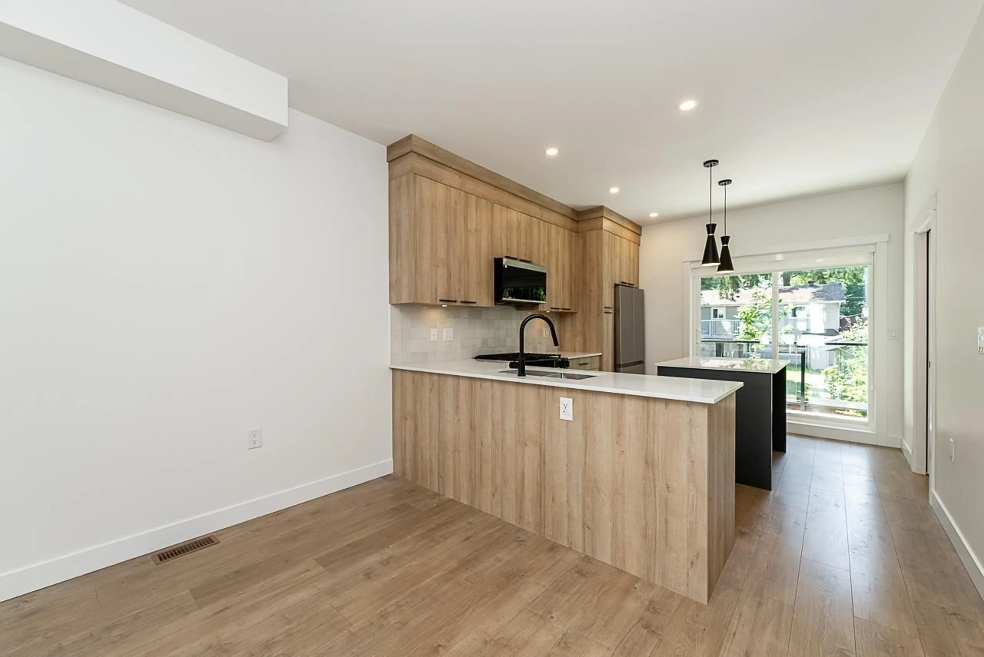 Open concept kitchen, wood/laminate floor for 9 - 10527 155 STREET, Surrey British Columbia V3R0S1