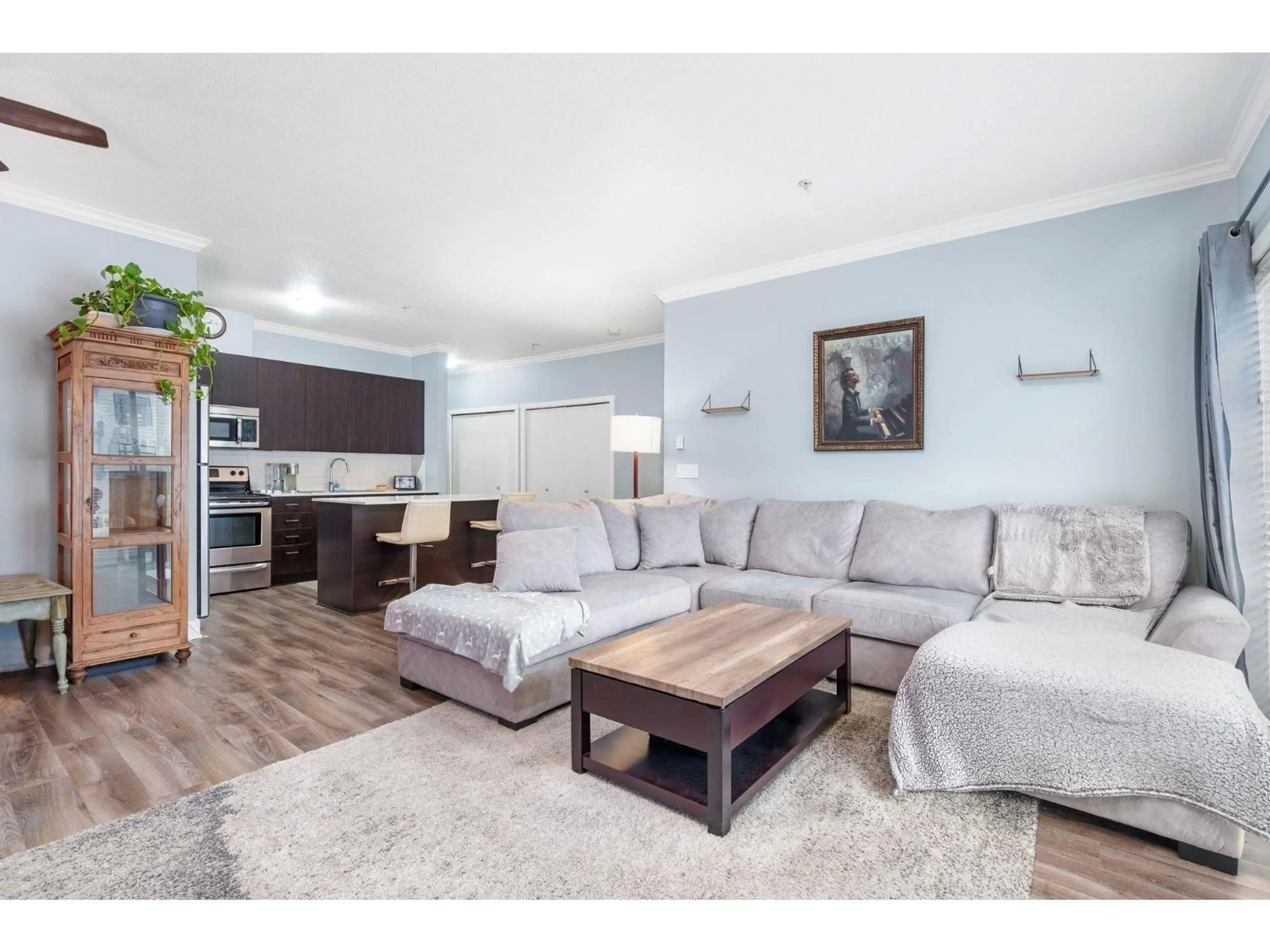 Living room with furniture, wood/laminate floor for 318 - 20460 DOUGLAS CRESCENT, Langley British Columbia V3A0C6