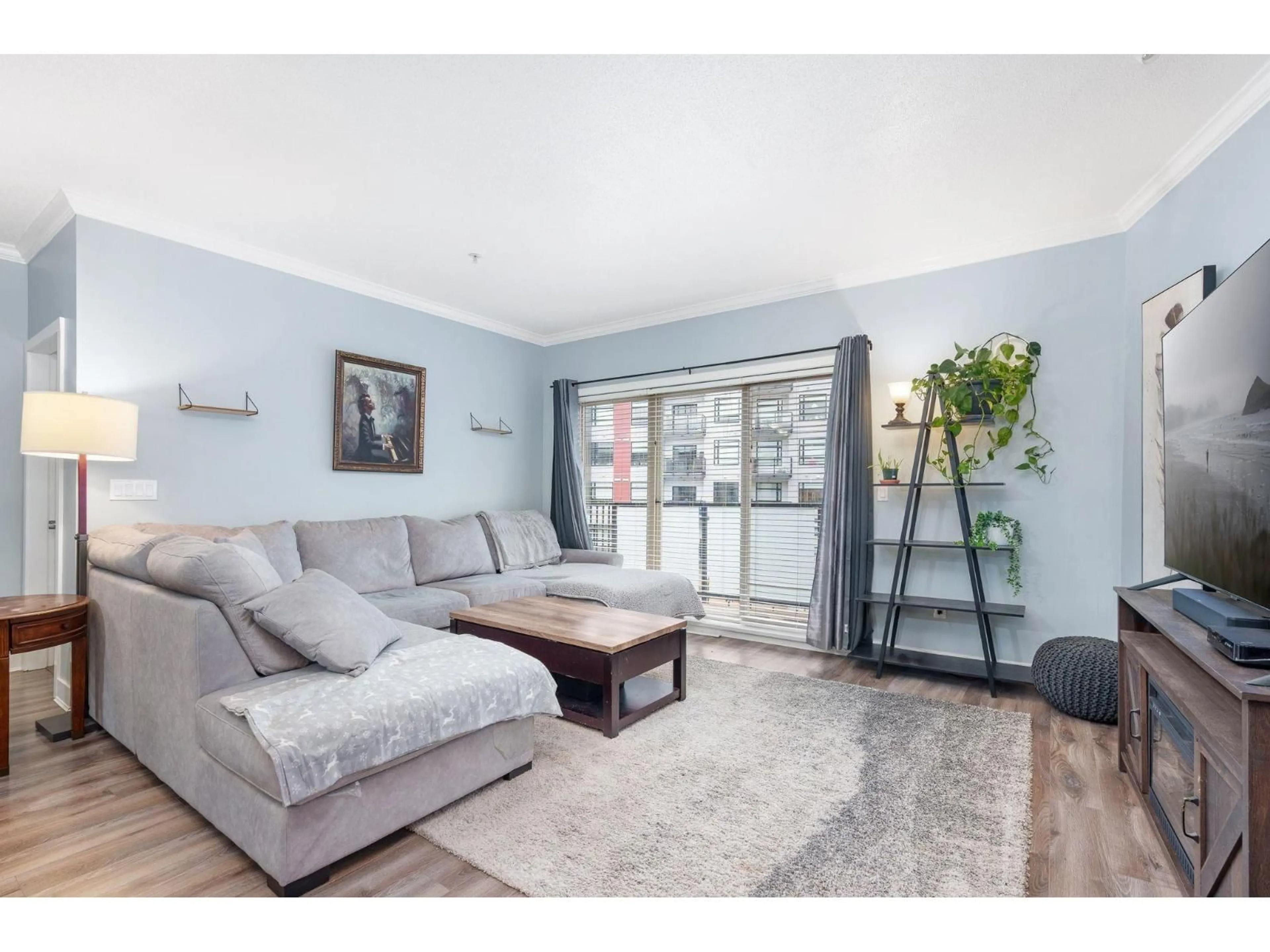 Living room with furniture, wood/laminate floor for 318 - 20460 DOUGLAS CRESCENT, Langley British Columbia V3A0C6
